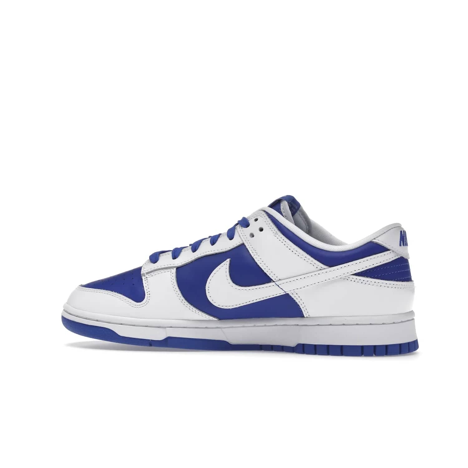 Nike Dunk Low Racer Blue White - Image 21 - Only at www.BallersClubKickz.com - Sleek Racer Blue leather upper and white leather overlays make up the Nike Dunk Low Racer Blue White. Woven tag and heel embroidery for a 1985 Dunk look with a matching EVA foam sole completes the classic colorway.