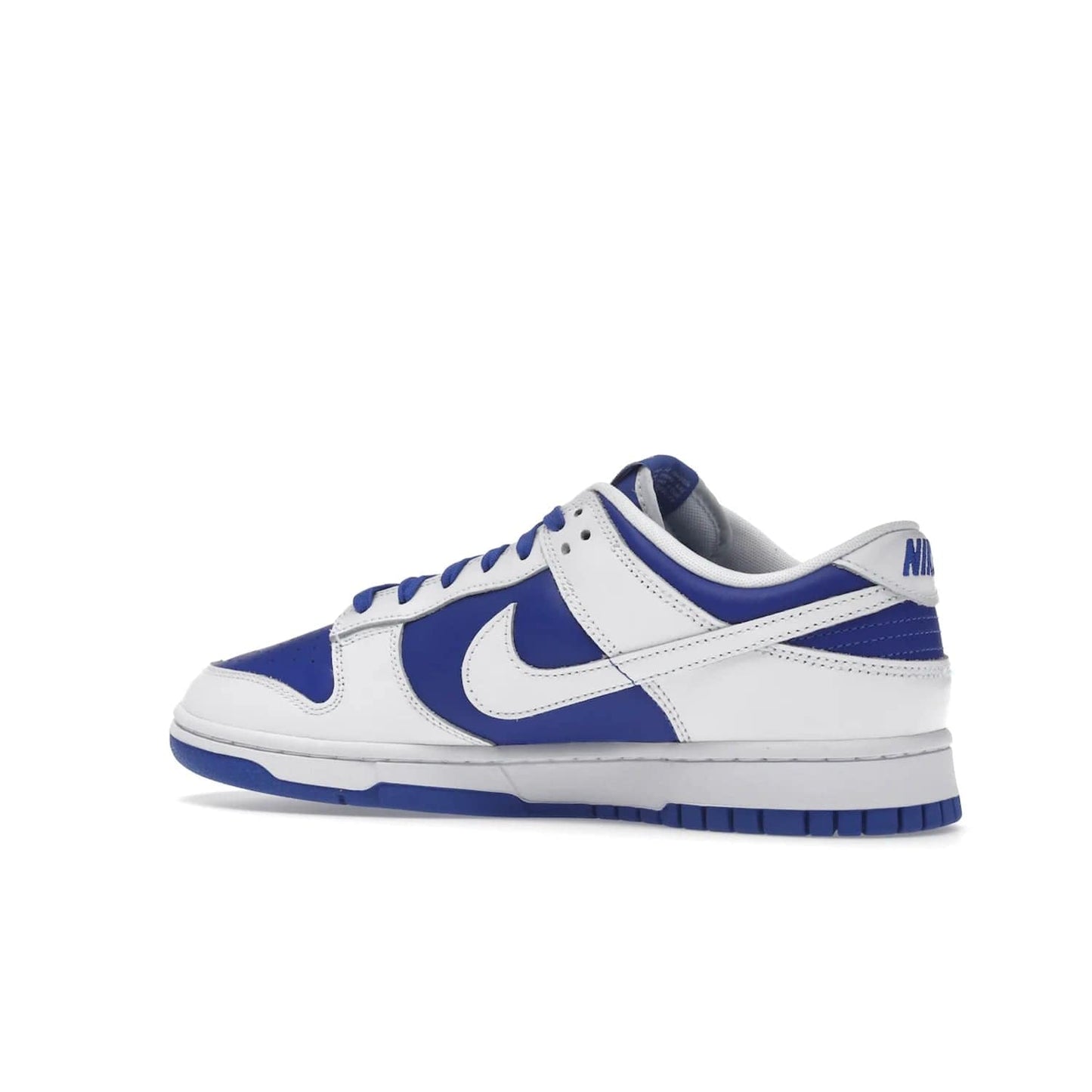 Nike Dunk Low Racer Blue White - Image 22 - Only at www.BallersClubKickz.com - Sleek Racer Blue leather upper and white leather overlays make up the Nike Dunk Low Racer Blue White. Woven tag and heel embroidery for a 1985 Dunk look with a matching EVA foam sole completes the classic colorway.