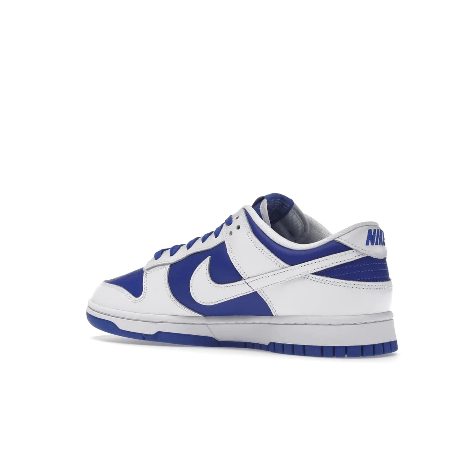 Nike Dunk Low Racer Blue White - Image 23 - Only at www.BallersClubKickz.com - Sleek Racer Blue leather upper and white leather overlays make up the Nike Dunk Low Racer Blue White. Woven tag and heel embroidery for a 1985 Dunk look with a matching EVA foam sole completes the classic colorway.