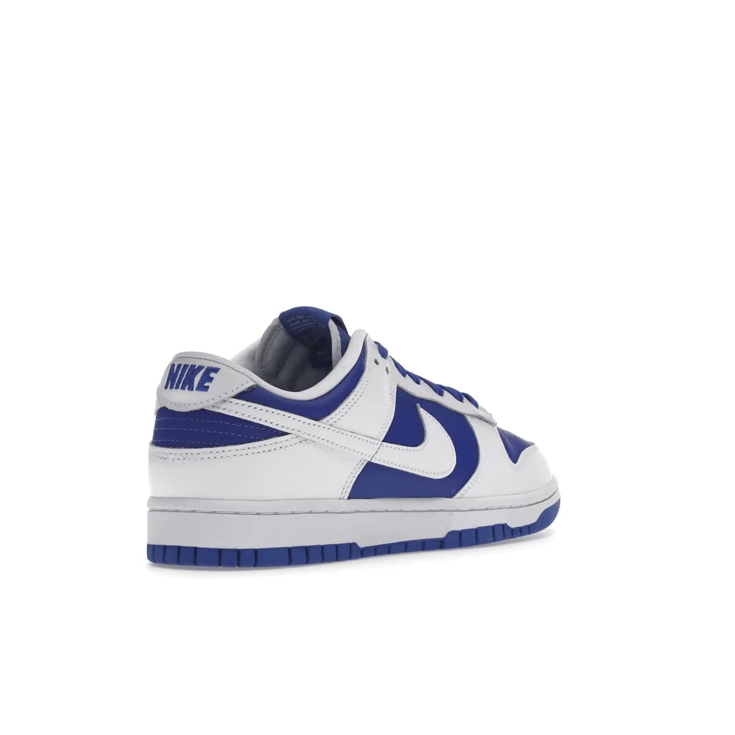 Nike Dunk Low Racer Blue White - Image 32 - Only at www.BallersClubKickz.com - Sleek Racer Blue leather upper and white leather overlays make up the Nike Dunk Low Racer Blue White. Woven tag and heel embroidery for a 1985 Dunk look with a matching EVA foam sole completes the classic colorway.