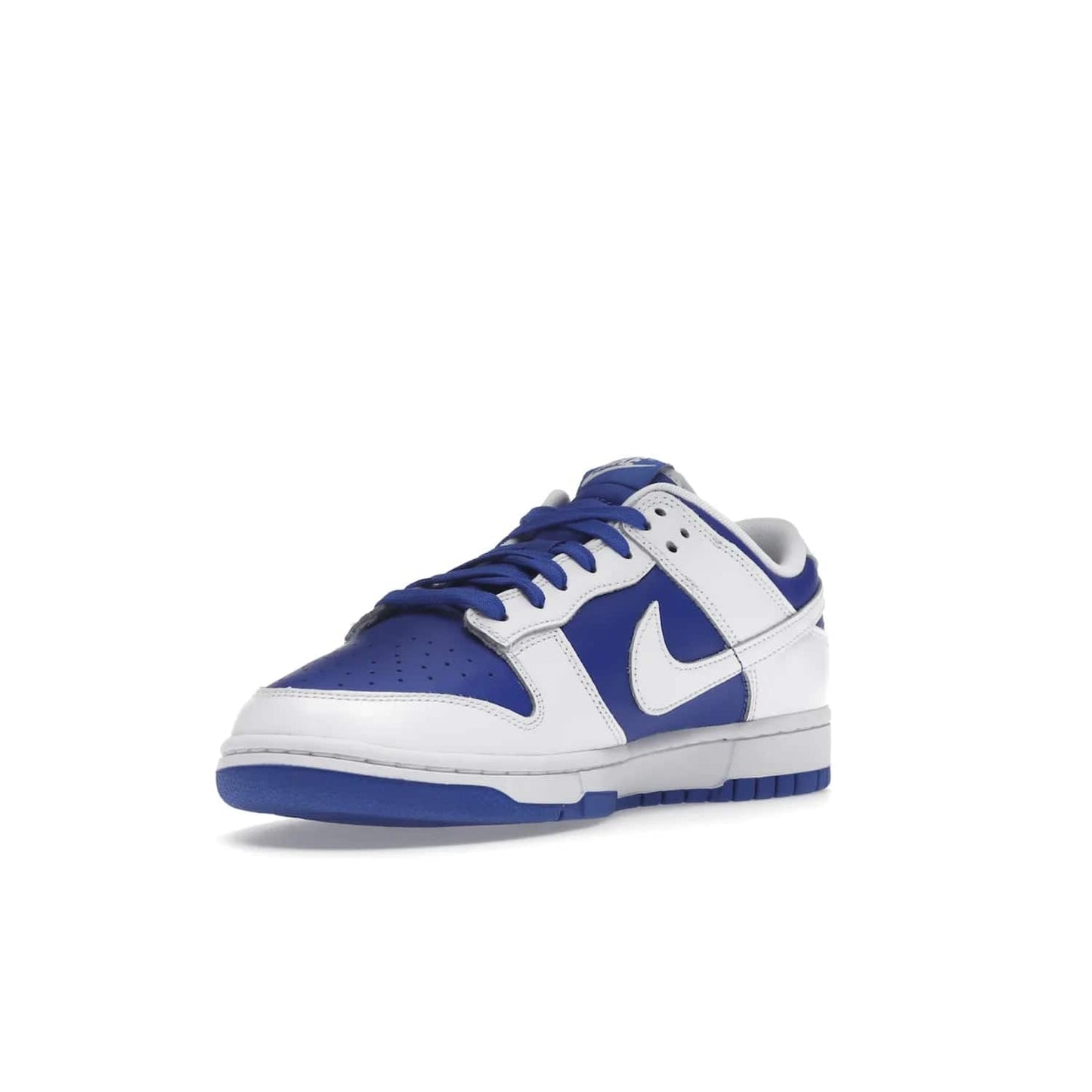 Nike Dunk Low Racer Blue White - Image 14 - Only at www.BallersClubKickz.com - Sleek Racer Blue leather upper and white leather overlays make up the Nike Dunk Low Racer Blue White. Woven tag and heel embroidery for a 1985 Dunk look with a matching EVA foam sole completes the classic colorway.