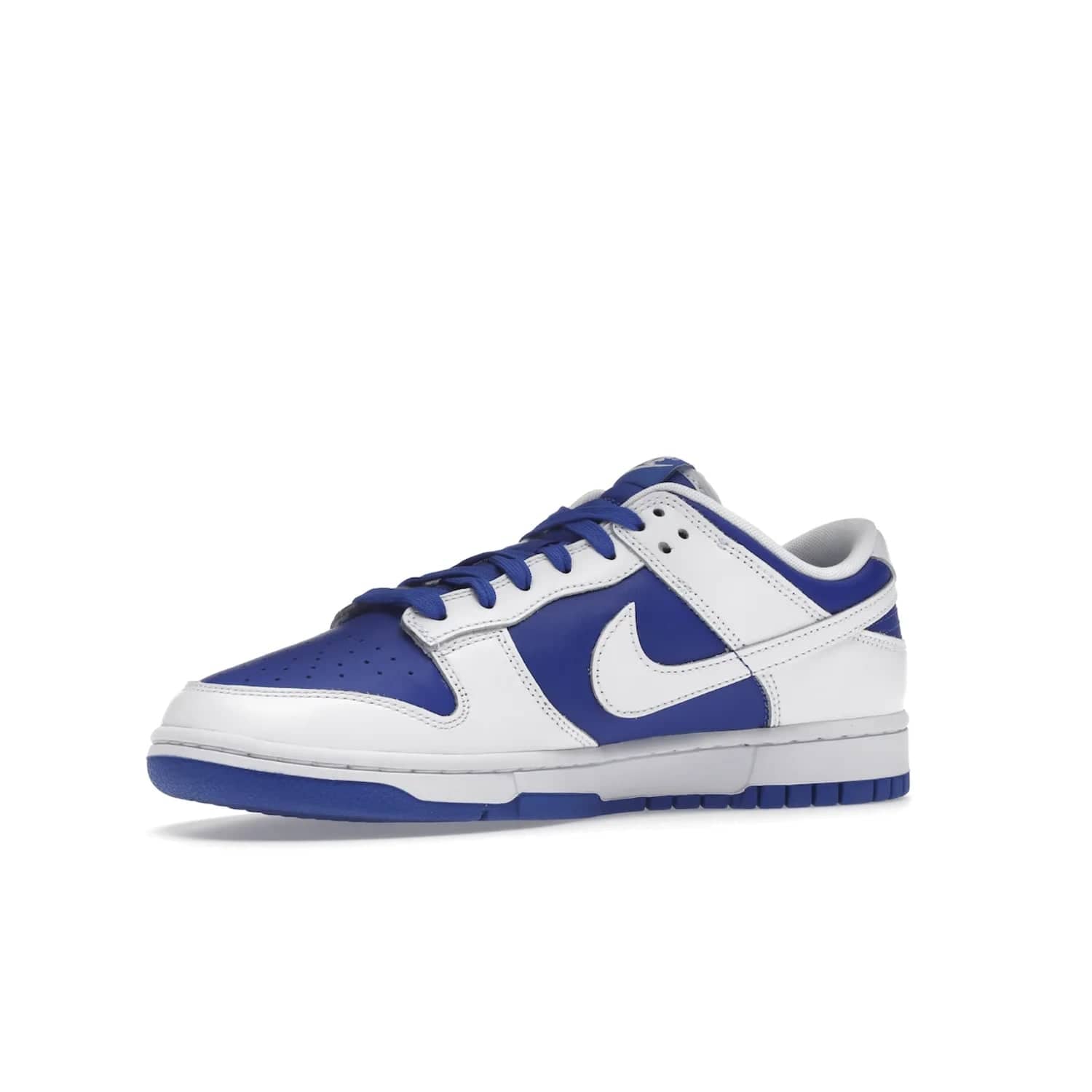 Nike Dunk Low Racer Blue White - Image 16 - Only at www.BallersClubKickz.com - Sleek Racer Blue leather upper and white leather overlays make up the Nike Dunk Low Racer Blue White. Woven tag and heel embroidery for a 1985 Dunk look with a matching EVA foam sole completes the classic colorway.