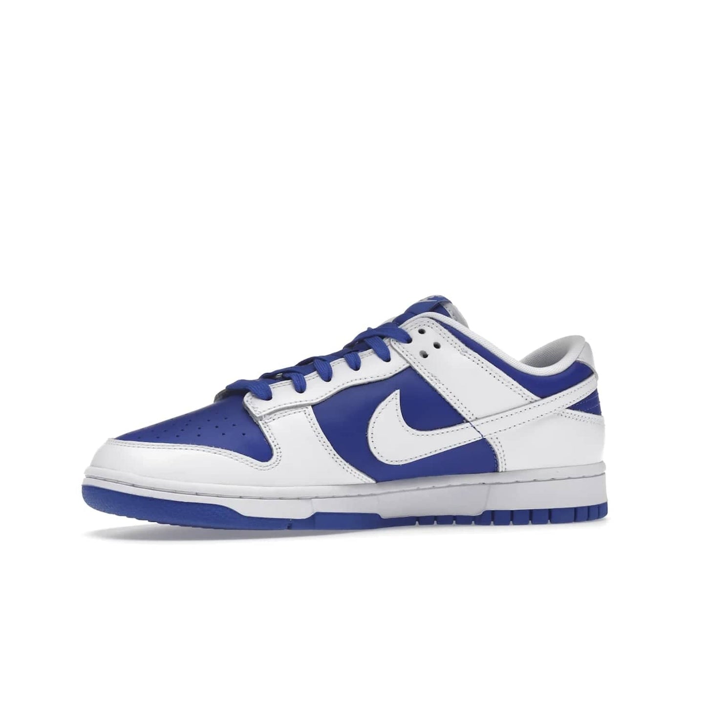 Nike Dunk Low Racer Blue White - Image 17 - Only at www.BallersClubKickz.com - Sleek Racer Blue leather upper and white leather overlays make up the Nike Dunk Low Racer Blue White. Woven tag and heel embroidery for a 1985 Dunk look with a matching EVA foam sole completes the classic colorway.