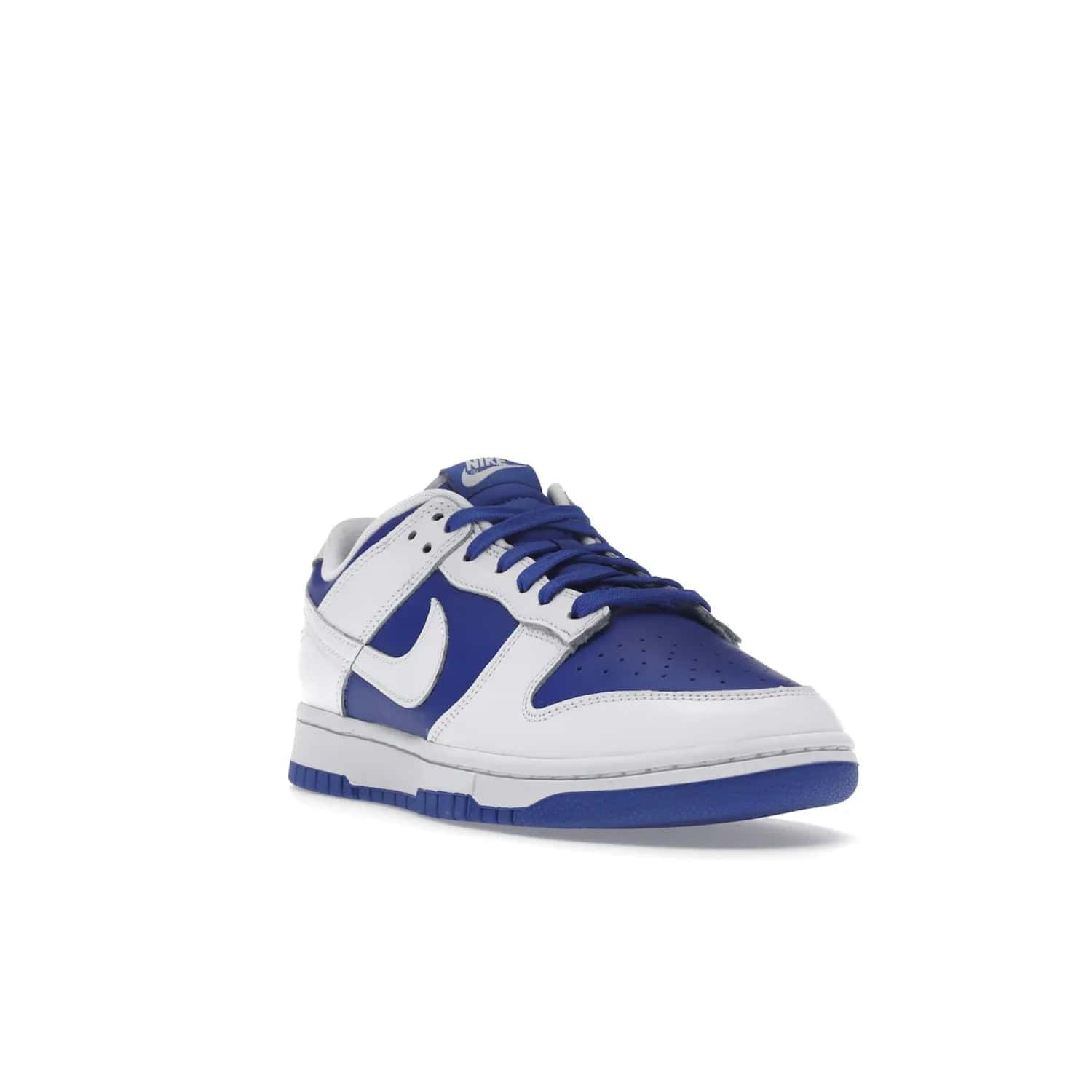 Nike Dunk Low Racer Blue White - Image 7 - Only at www.BallersClubKickz.com - Sleek Racer Blue leather upper and white leather overlays make up the Nike Dunk Low Racer Blue White. Woven tag and heel embroidery for a 1985 Dunk look with a matching EVA foam sole completes the classic colorway.