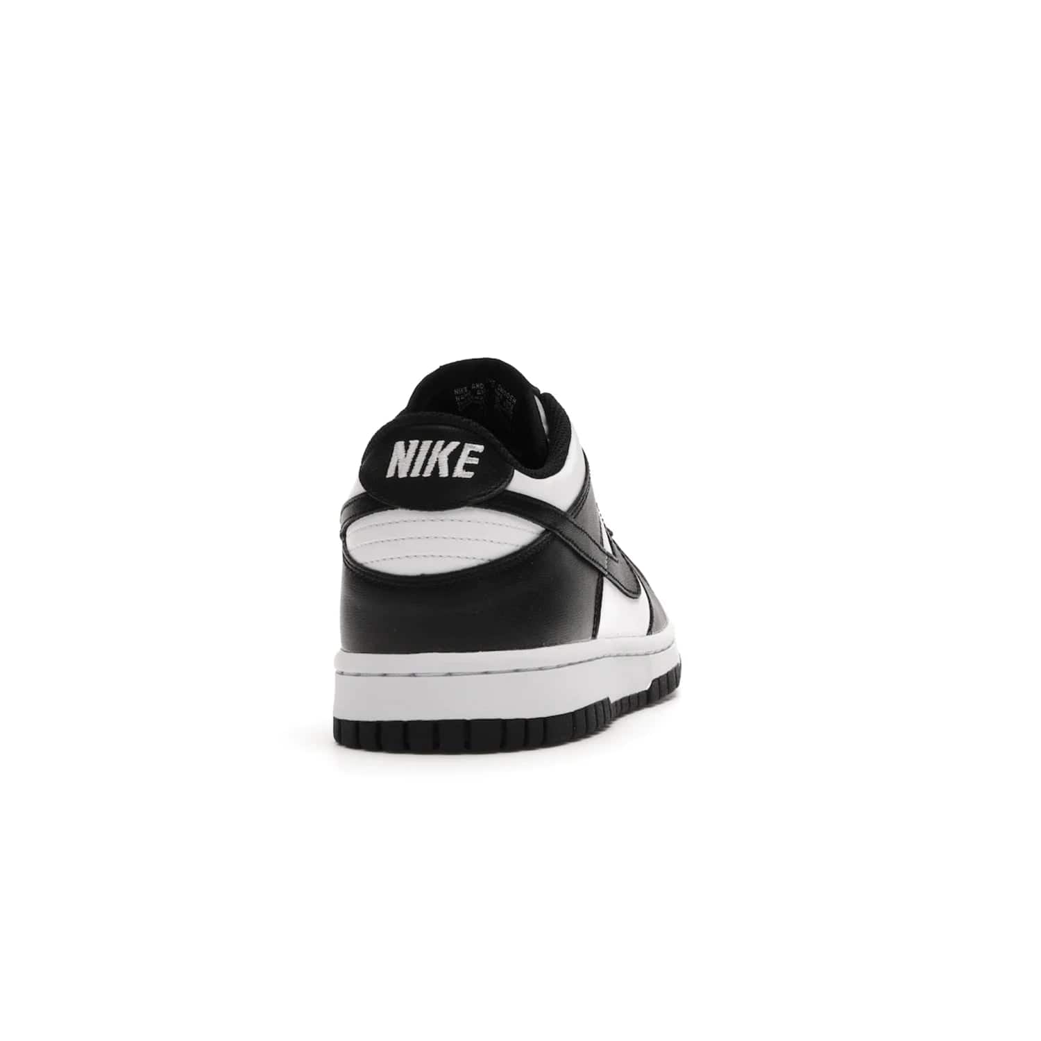 Nike Dunk Low Retro White Black Panda (2021) (GS) - Image 29 - Only at www.BallersClubKickz.com - Upgrade your style with the Nike Dunk Low Retro White Black (GS). Featuring premium leather, iconic Nike text, signature Swoosh logo and striking black/white colorway, this striking silhouette is the perfect mix of style and comfort. Colorway released in March 2021.