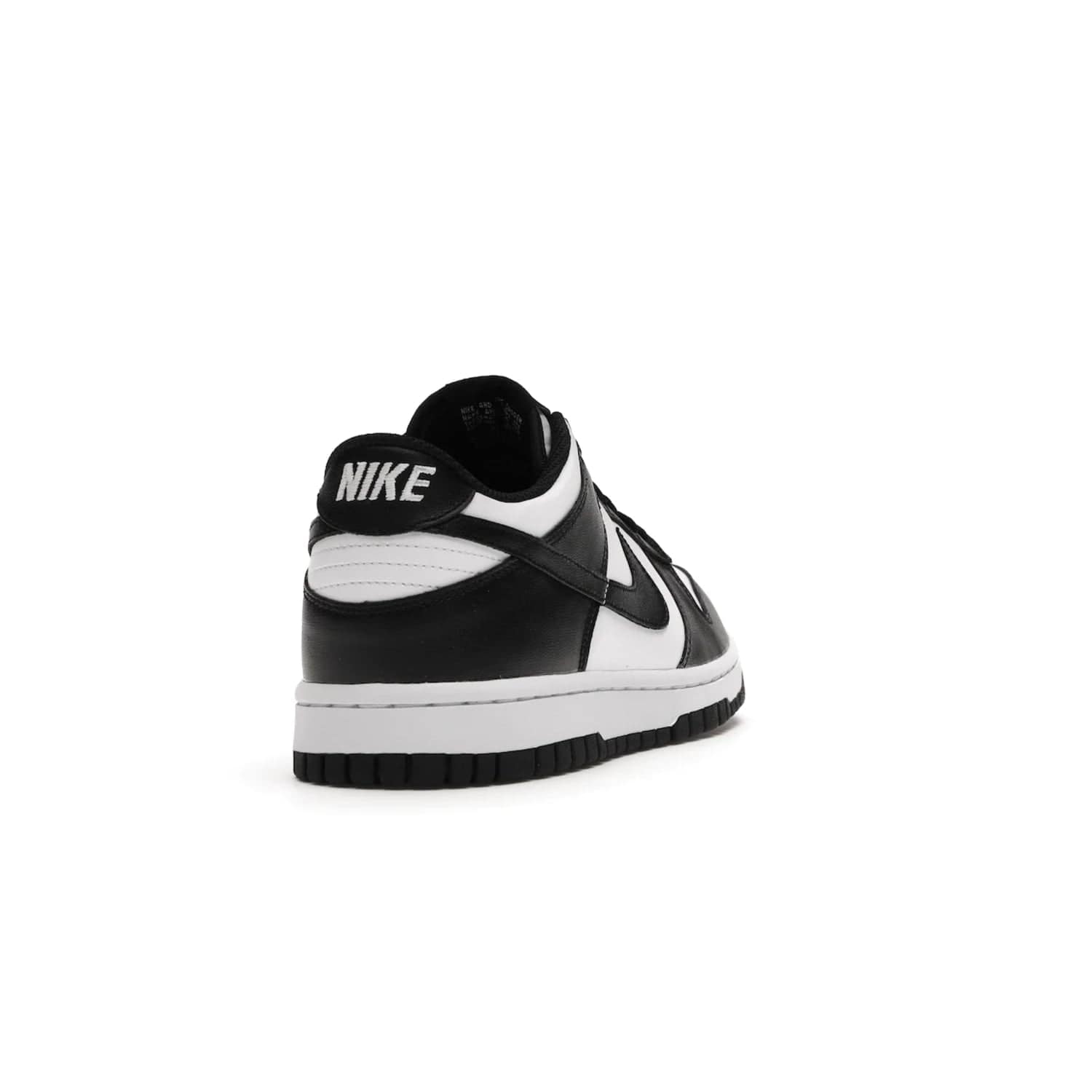 Nike Dunk Low Retro White Black Panda (2021) (GS) - Image 30 - Only at www.BallersClubKickz.com - Upgrade your style with the Nike Dunk Low Retro White Black (GS). Featuring premium leather, iconic Nike text, signature Swoosh logo and striking black/white colorway, this striking silhouette is the perfect mix of style and comfort. Colorway released in March 2021.