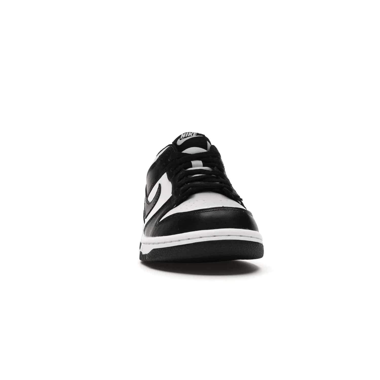 Nike Dunk Low Retro White Black Panda (2021) (GS) - Image 9 - Only at www.BallersClubKickz.com - Upgrade your style with the Nike Dunk Low Retro White Black (GS). Featuring premium leather, iconic Nike text, signature Swoosh logo and striking black/white colorway, this striking silhouette is the perfect mix of style and comfort. Colorway released in March 2021.