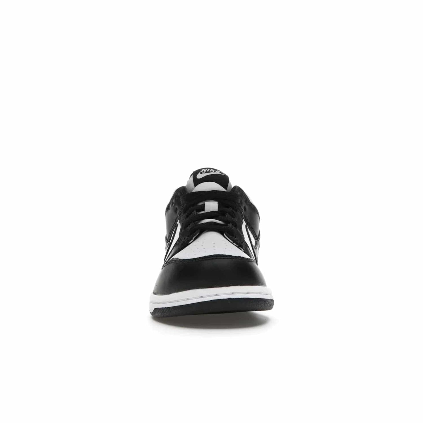 Nike Dunk Low Retro White Black Panda (2021) (PS) - Image 10 - Only at www.BallersClubKickz.com - Retro basketball style with modern updates: Nike Dunk Low PS White/Black. Find the classic sneaker with all-white leather upper, black overlays, black Swoosh branding an more. Originally released in March 2021.