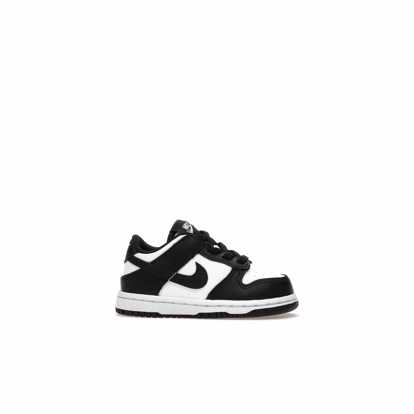 Nike Dunk Low Retro White Black Panda (2021) (TD) - Image 2 - Only at www.BallersClubKickz.com - The perfect blend of classic style and modern style, the Nike Dunk Low Retro White Black (TD) toddler shoe has a soft leather upper, white midsole, and black outsole. Signature Swoosh branding and lightly padded tongue give it timeless Nike style. Released in March 2021.