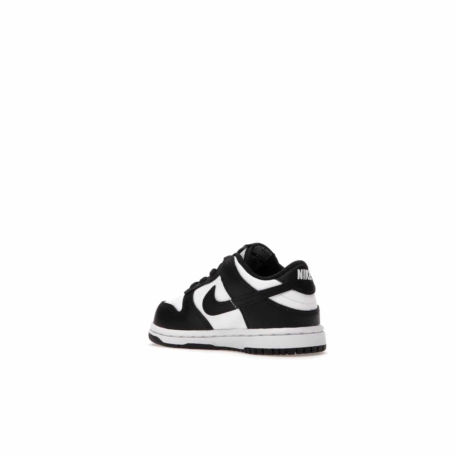 Nike Dunk Low Retro White Black Panda (2021) (TD) - Image 23 - Only at www.BallersClubKickz.com - The perfect blend of classic style and modern style, the Nike Dunk Low Retro White Black (TD) toddler shoe has a soft leather upper, white midsole, and black outsole. Signature Swoosh branding and lightly padded tongue give it timeless Nike style. Released in March 2021.