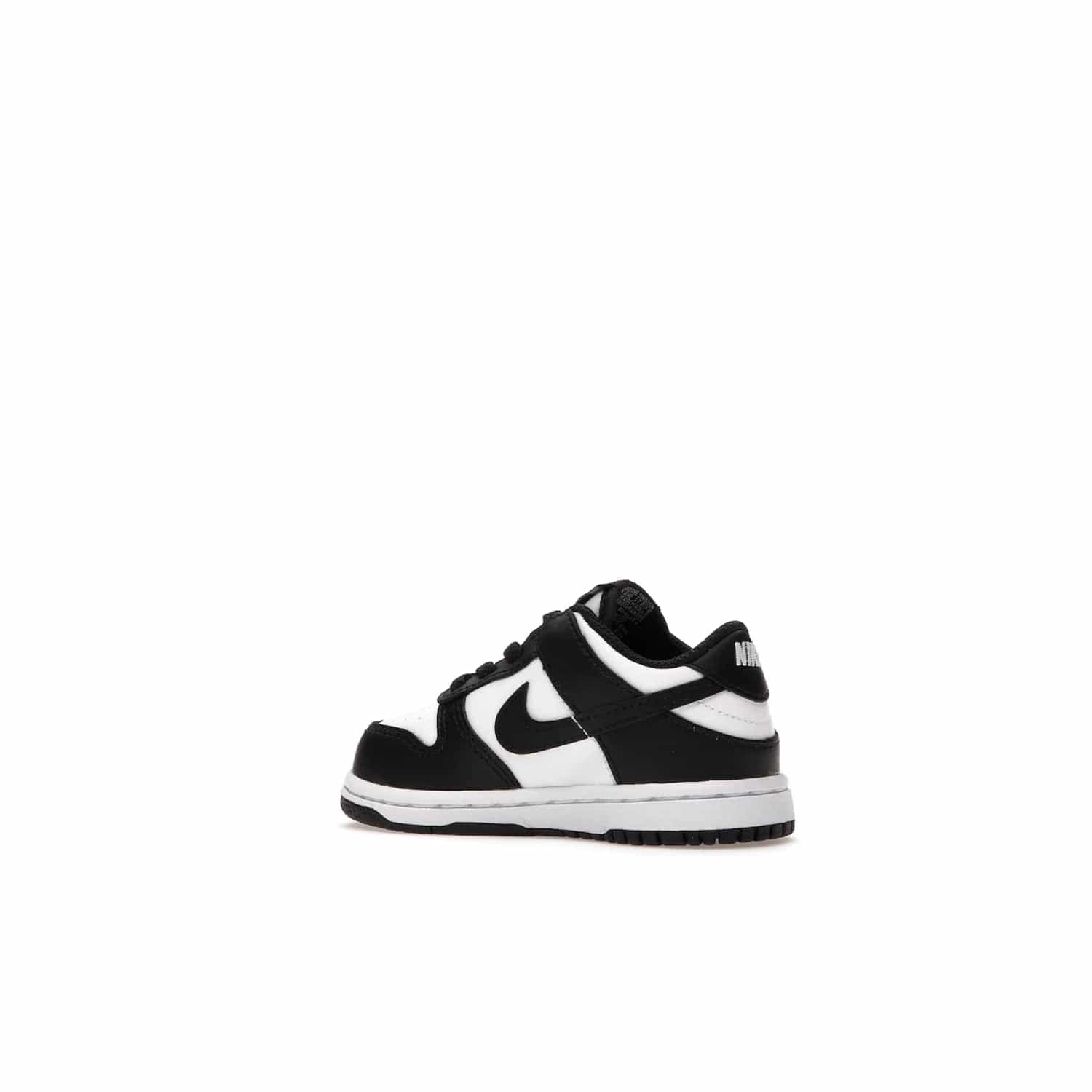 Nike Dunk Low Retro White Black Panda (2021) (TD) - Image 22 - Only at www.BallersClubKickz.com - The perfect blend of classic style and modern style, the Nike Dunk Low Retro White Black (TD) toddler shoe has a soft leather upper, white midsole, and black outsole. Signature Swoosh branding and lightly padded tongue give it timeless Nike style. Released in March 2021.