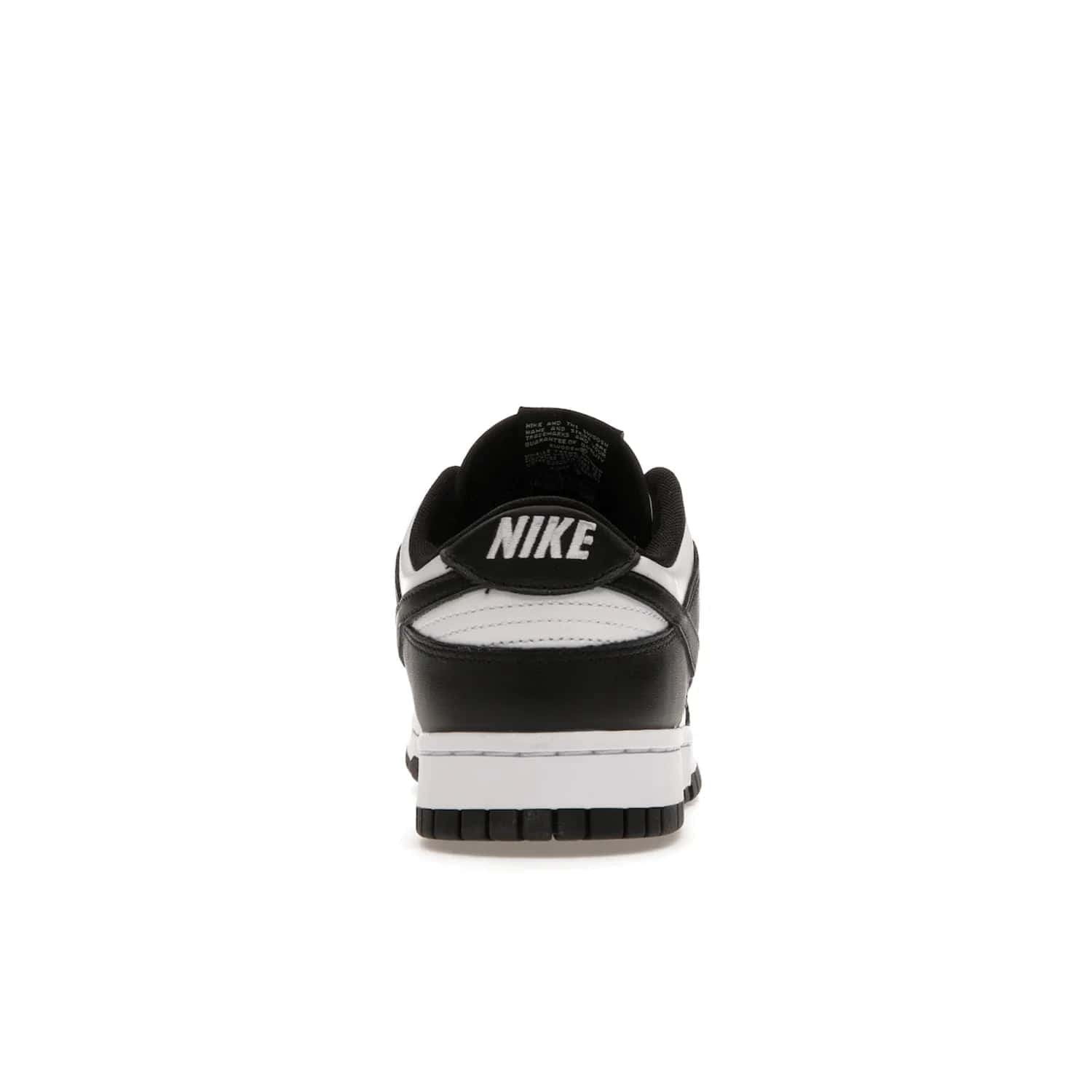 Nike Dunk Low Retro White Black Panda (2021) - Image 28 - Only at www.BallersClubKickz.com - Shop the Nike Dunk Low Retro White Black for classic styling featuring white leather with black leather overlays and classic Nike branding. Released in 2021, this timeless design offers a white midsole and black outsole for a stylish look. Shop all the Nike Dunks & rock this classic look.