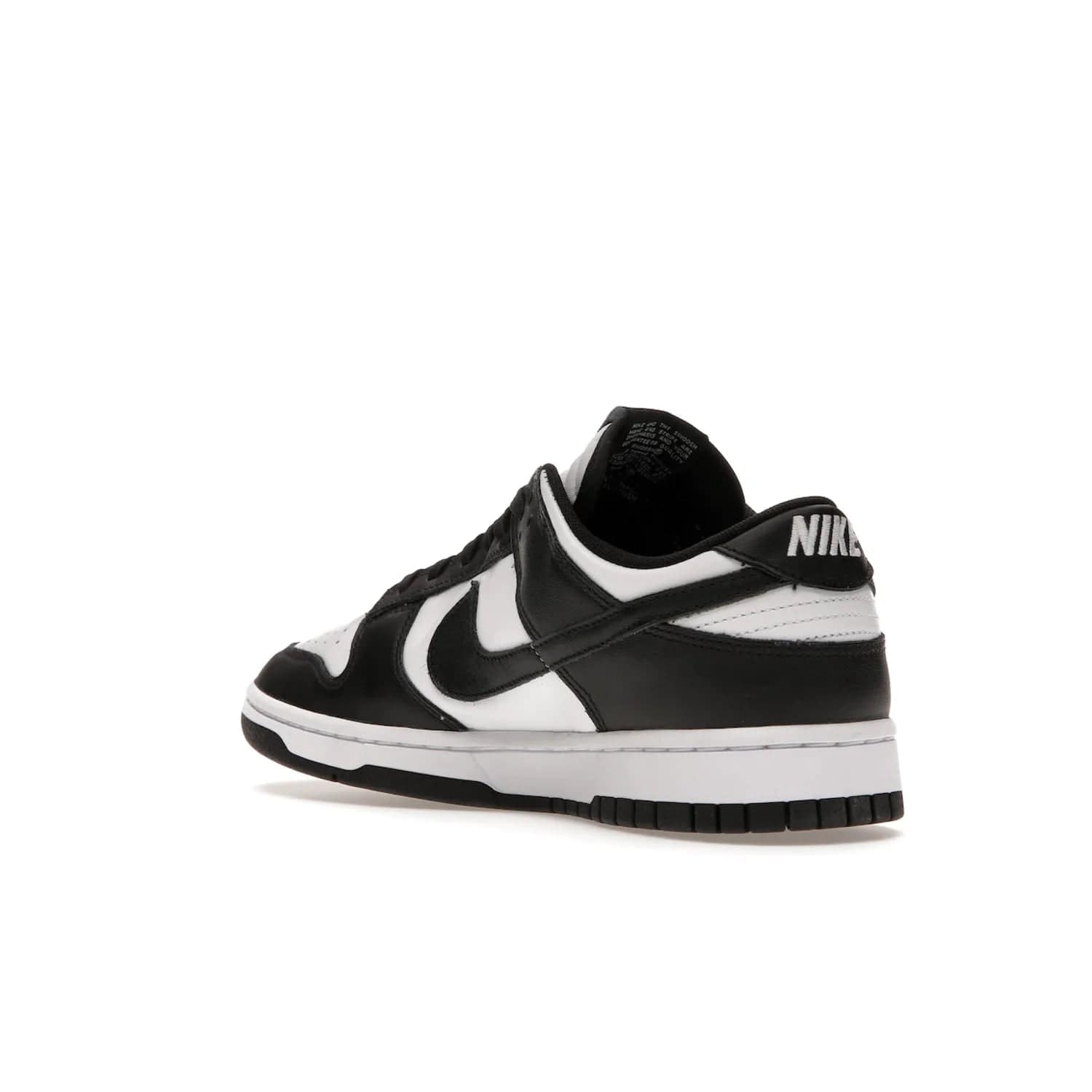 Nike Dunk Low Retro White Black Panda (2021) - Image 24 - Only at www.BallersClubKickz.com - Shop the Nike Dunk Low Retro White Black for classic styling featuring white leather with black leather overlays and classic Nike branding. Released in 2021, this timeless design offers a white midsole and black outsole for a stylish look. Shop all the Nike Dunks & rock this classic look.