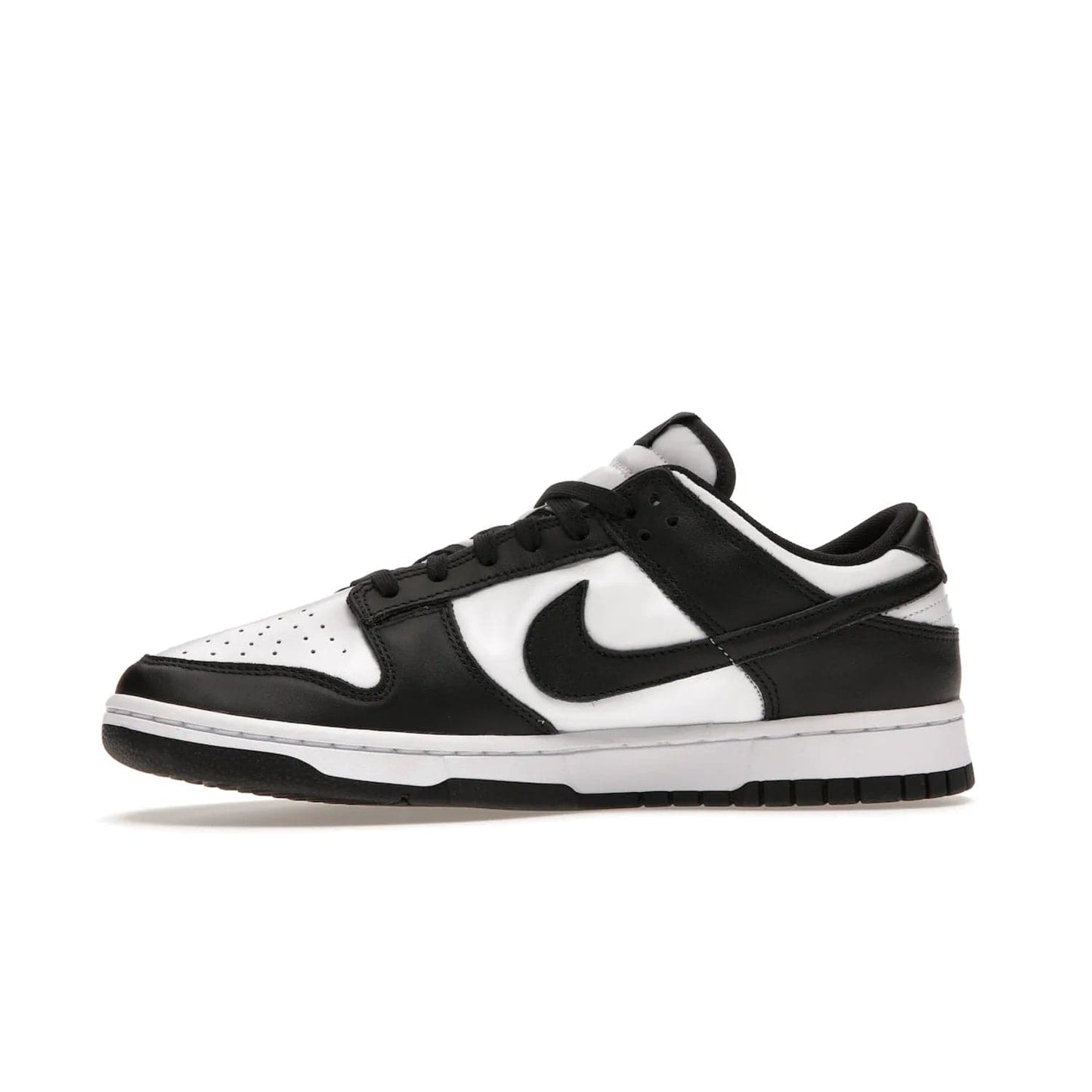 Nike Dunk Low Retro White Black Panda (2021) - Image 18 - Only at www.BallersClubKickz.com - Shop the Nike Dunk Low Retro White Black for classic styling featuring white leather with black leather overlays and classic Nike branding. Released in 2021, this timeless design offers a white midsole and black outsole for a stylish look. Shop all the Nike Dunks & rock this classic look.