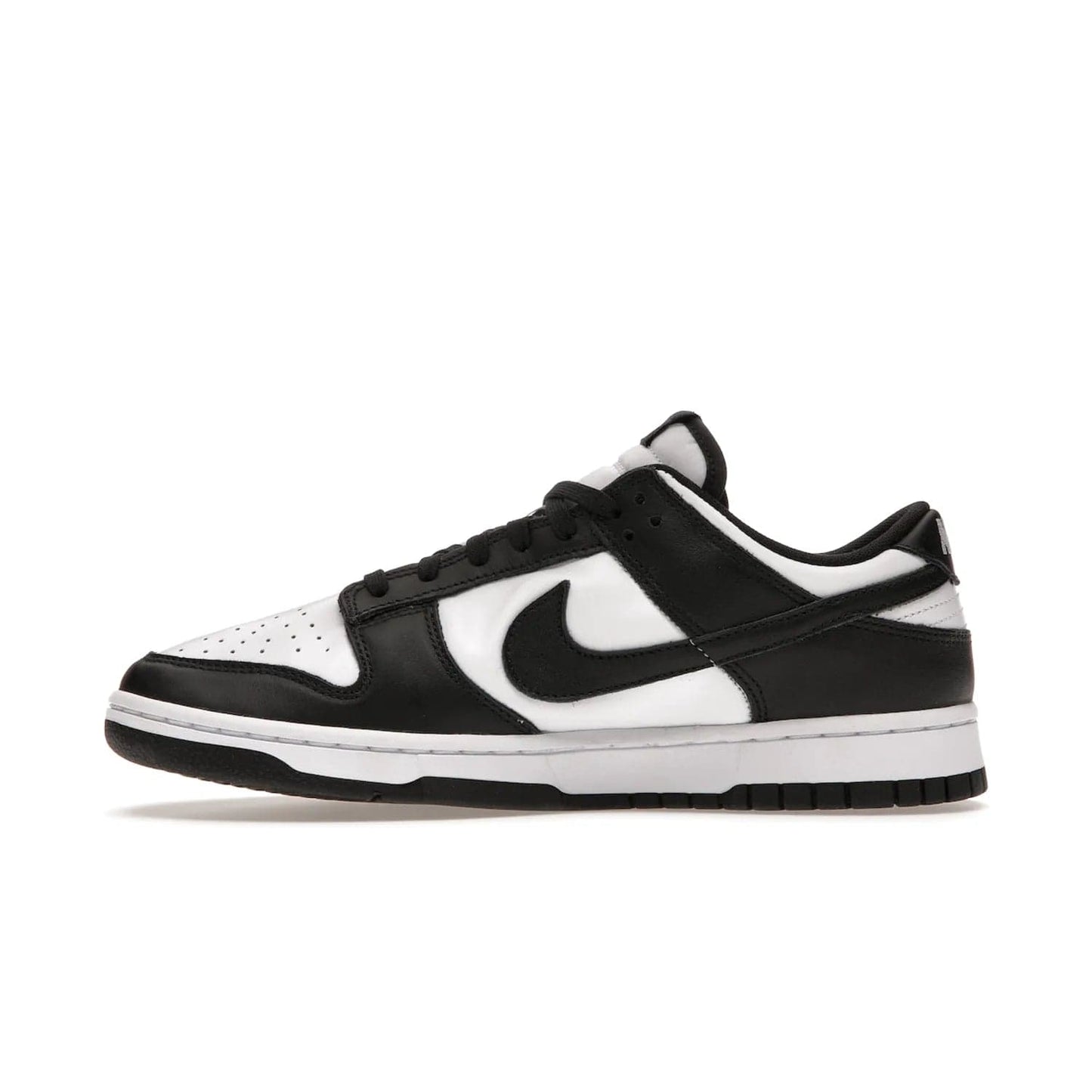 Nike Dunk Low Retro White Black Panda (2021) - Image 19 - Only at www.BallersClubKickz.com - Shop the Nike Dunk Low Retro White Black for classic styling featuring white leather with black leather overlays and classic Nike branding. Released in 2021, this timeless design offers a white midsole and black outsole for a stylish look. Shop all the Nike Dunks & rock this classic look.
