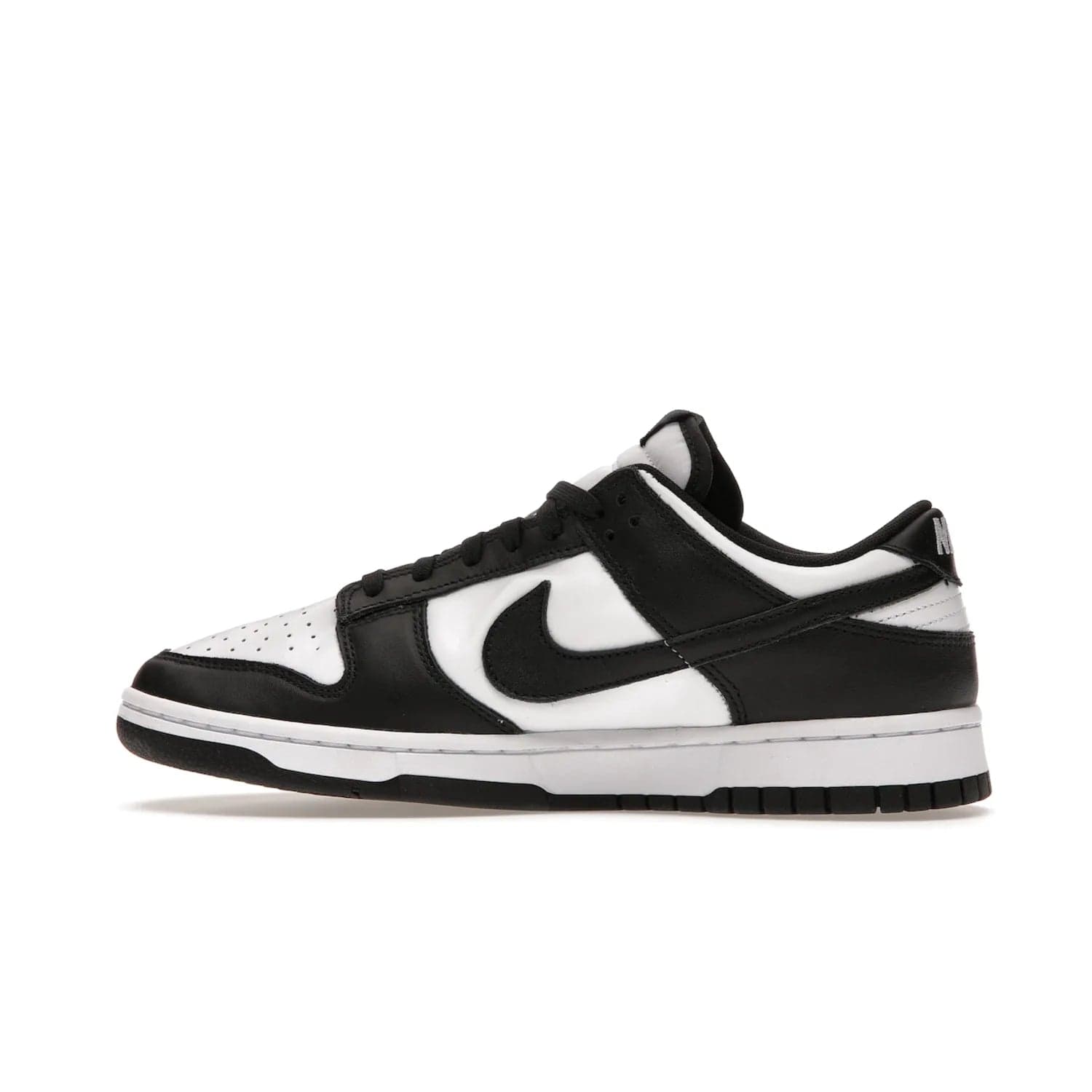 Nike Dunk Low Retro White Black Panda (2021) - Image 20 - Only at www.BallersClubKickz.com - Shop the Nike Dunk Low Retro White Black for classic styling featuring white leather with black leather overlays and classic Nike branding. Released in 2021, this timeless design offers a white midsole and black outsole for a stylish look. Shop all the Nike Dunks & rock this classic look.