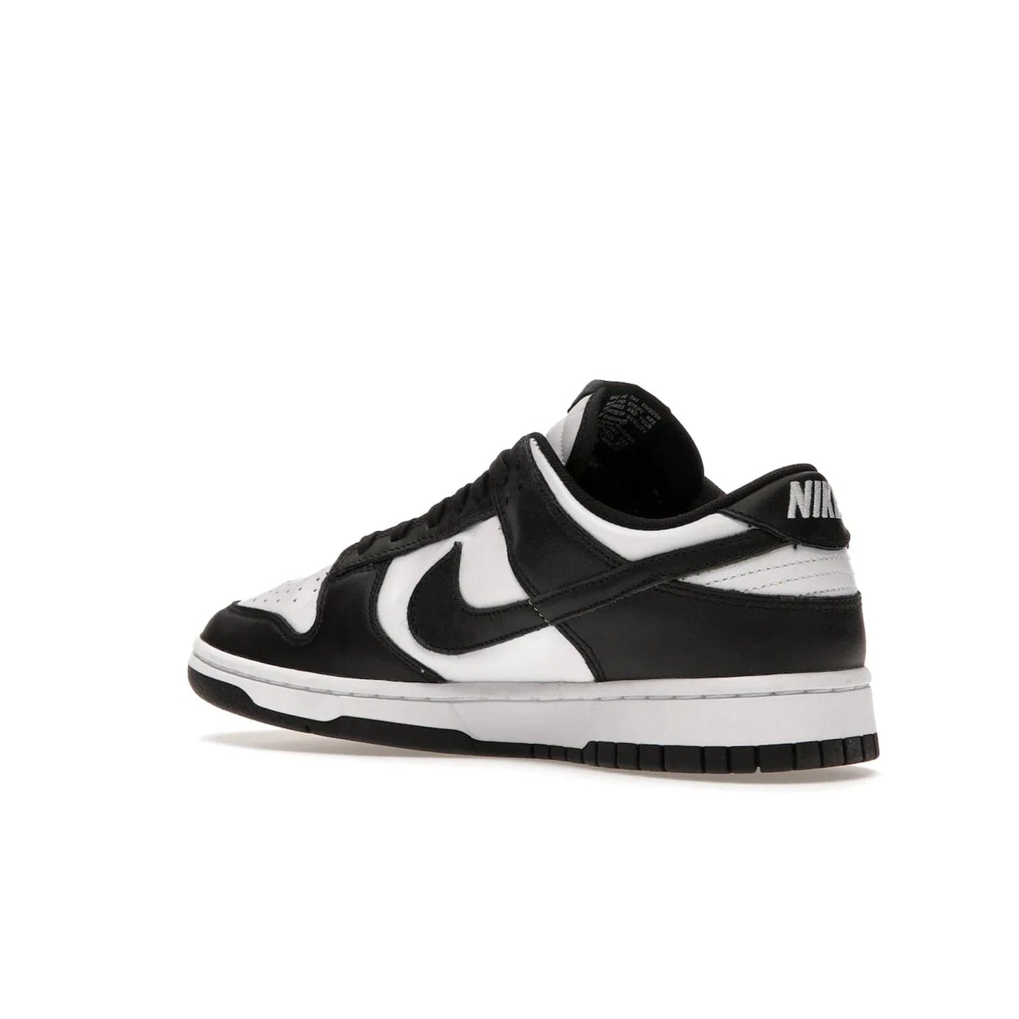 Nike Dunk Low Retro White Black Panda (2021) - Image 23 - Only at www.BallersClubKickz.com - Shop the Nike Dunk Low Retro White Black for classic styling featuring white leather with black leather overlays and classic Nike branding. Released in 2021, this timeless design offers a white midsole and black outsole for a stylish look. Shop all the Nike Dunks & rock this classic look.