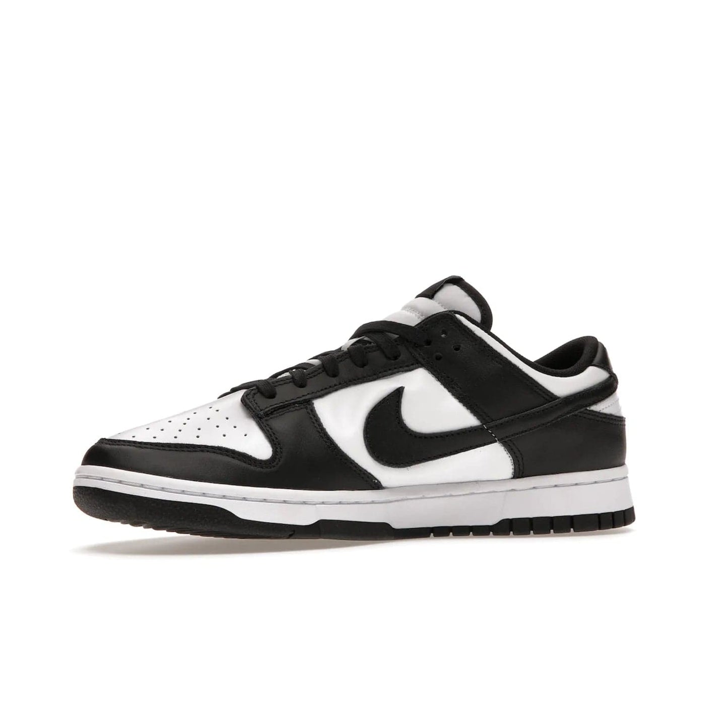Nike Dunk Low Retro White Black Panda (2021) - Image 17 - Only at www.BallersClubKickz.com - Shop the Nike Dunk Low Retro White Black for classic styling featuring white leather with black leather overlays and classic Nike branding. Released in 2021, this timeless design offers a white midsole and black outsole for a stylish look. Shop all the Nike Dunks & rock this classic look.
