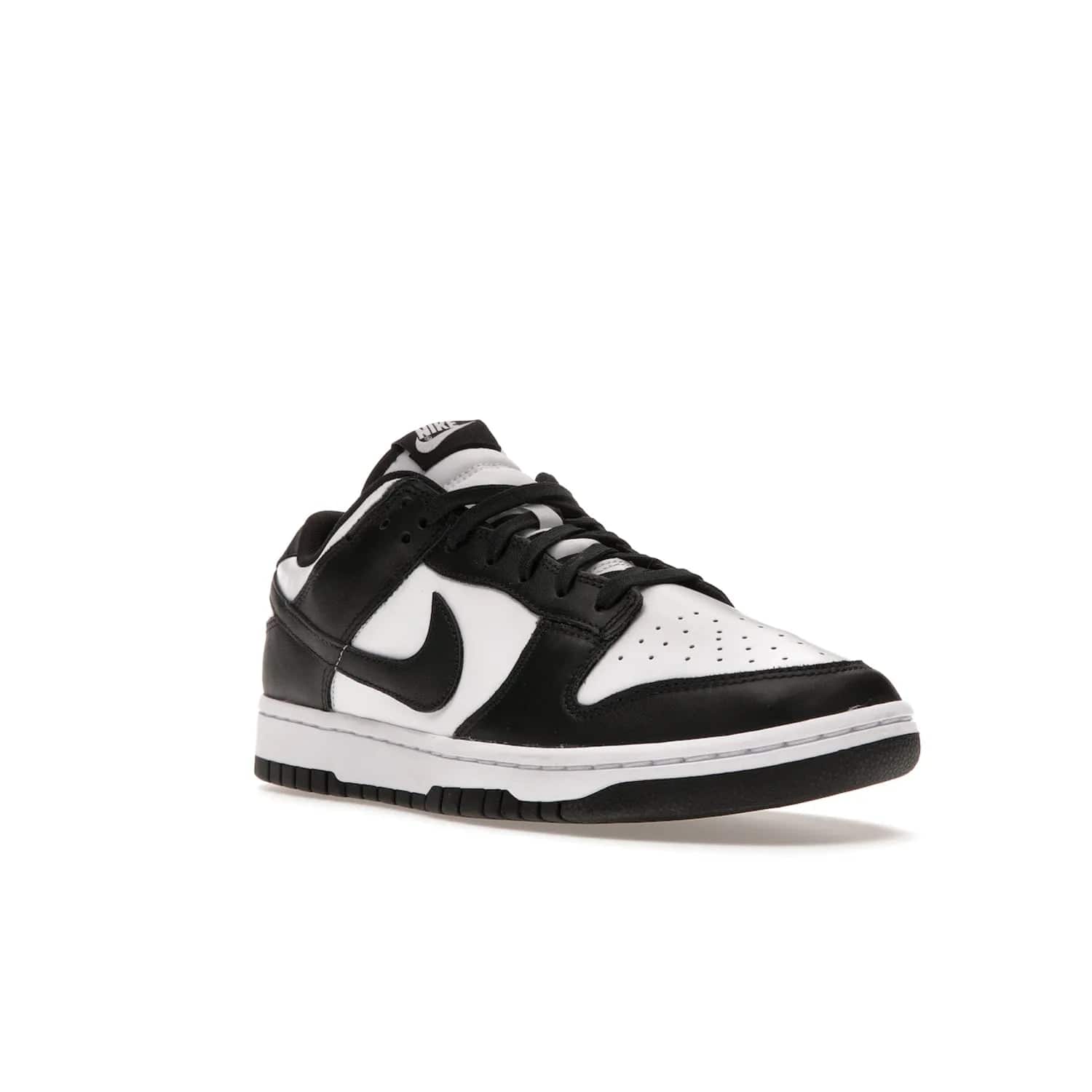 Nike Dunk Low Retro White Black Panda (2021) - Image 6 - Only at www.BallersClubKickz.com - Shop the Nike Dunk Low Retro White Black for classic styling featuring white leather with black leather overlays and classic Nike branding. Released in 2021, this timeless design offers a white midsole and black outsole for a stylish look. Shop all the Nike Dunks & rock this classic look.