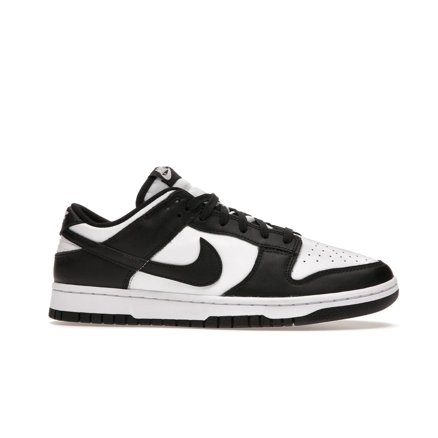 Nike Dunk Low Retro White Black Panda (2021) - Image 2 - Only at www.BallersClubKickz.com - Shop the Nike Dunk Low Retro White Black for classic styling featuring white leather with black leather overlays and classic Nike branding. Released in 2021, this timeless design offers a white midsole and black outsole for a stylish look. Shop all the Nike Dunks & rock this classic look.