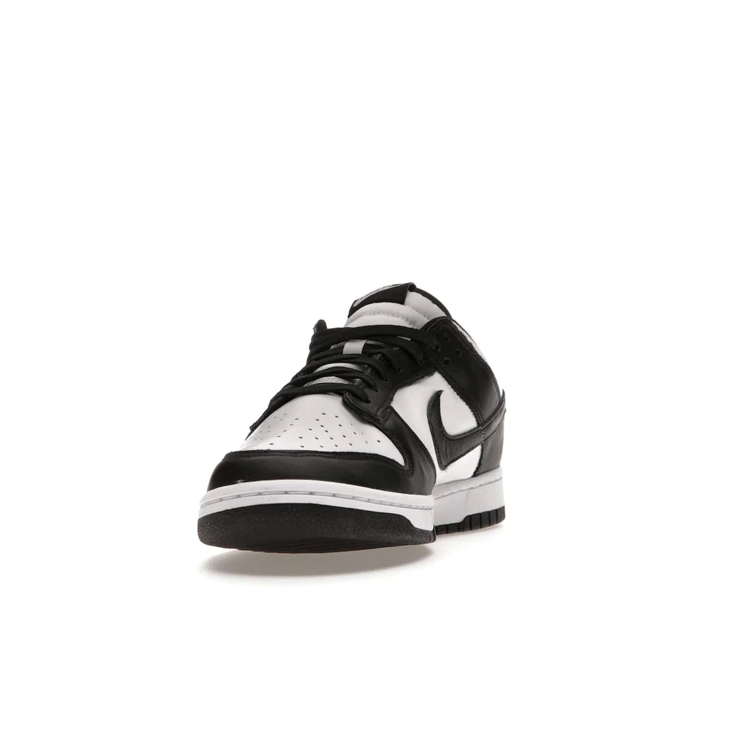 Nike Dunk Low Retro White Black Panda (2021) - Image 12 - Only at www.BallersClubKickz.com - Shop the Nike Dunk Low Retro White Black for classic styling featuring white leather with black leather overlays and classic Nike branding. Released in 2021, this timeless design offers a white midsole and black outsole for a stylish look. Shop all the Nike Dunks & rock this classic look.