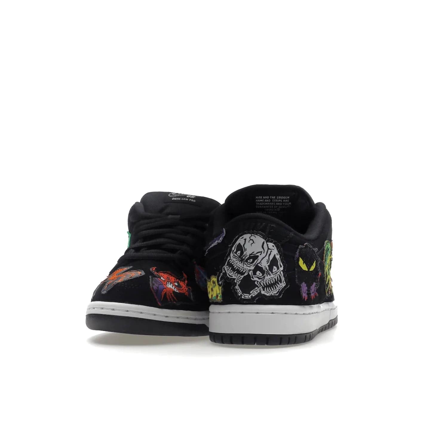 Nike SB Dunk Low Pro QS Neckface - Image 29 - Only at www.BallersClubKickz.com - Introducing the Nike SB Dunk Low Pro QS Neckface. Get spooky street style with black nubuck uppers featuring ghouls, tombstones, skulls, and more. The perfect mix of eye-catching details and a white midsole. Available now.