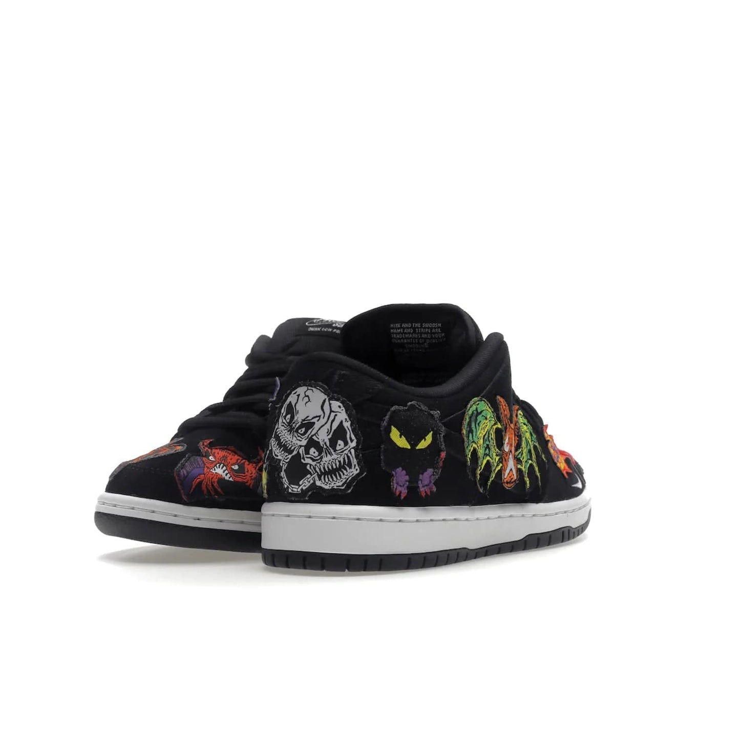 Nike SB Dunk Low Pro QS Neckface - Image 31 - Only at www.BallersClubKickz.com - Introducing the Nike SB Dunk Low Pro QS Neckface. Get spooky street style with black nubuck uppers featuring ghouls, tombstones, skulls, and more. The perfect mix of eye-catching details and a white midsole. Available now.