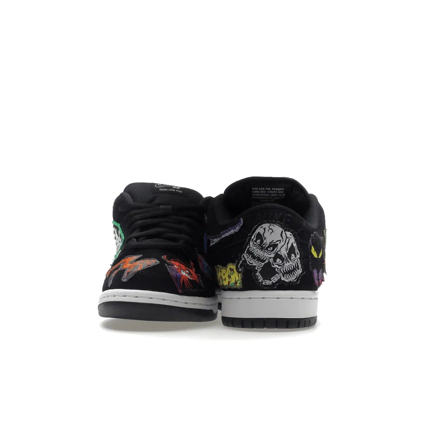 Nike SB Dunk Low Pro QS Neckface - Image 28 - Only at www.BallersClubKickz.com - Introducing the Nike SB Dunk Low Pro QS Neckface. Get spooky street style with black nubuck uppers featuring ghouls, tombstones, skulls, and more. The perfect mix of eye-catching details and a white midsole. Available now.