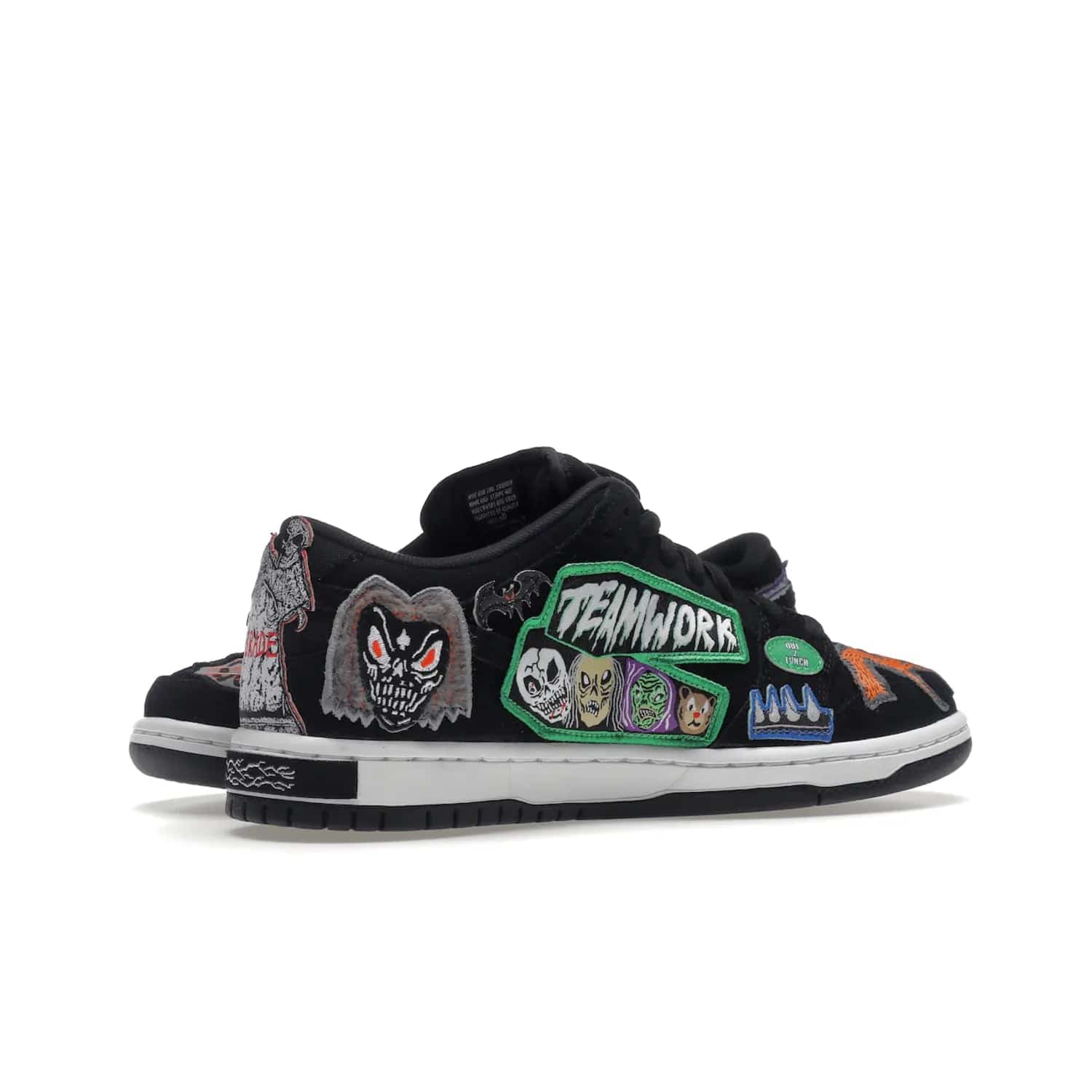 Nike SB Dunk Low Pro QS Neckface - Image 16 - Only at www.BallersClubKickz.com - Introducing the Nike SB Dunk Low Pro QS Neckface. Get spooky street style with black nubuck uppers featuring ghouls, tombstones, skulls, and more. The perfect mix of eye-catching details and a white midsole. Available now.