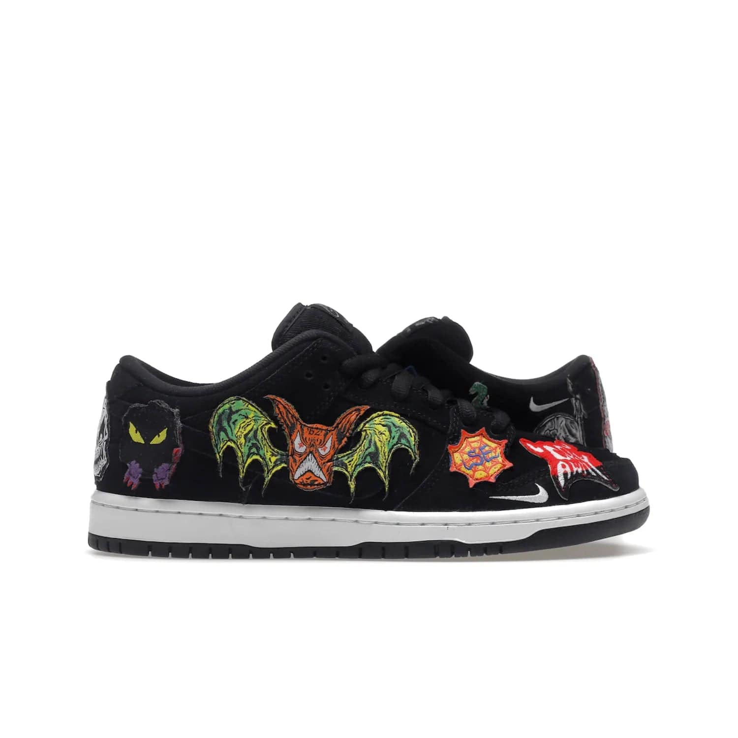 Nike SB Dunk Low Pro QS Neckface - Image 1 - Only at www.BallersClubKickz.com - Introducing the Nike SB Dunk Low Pro QS Neckface. Get spooky street style with black nubuck uppers featuring ghouls, tombstones, skulls, and more. The perfect mix of eye-catching details and a white midsole. Available now.