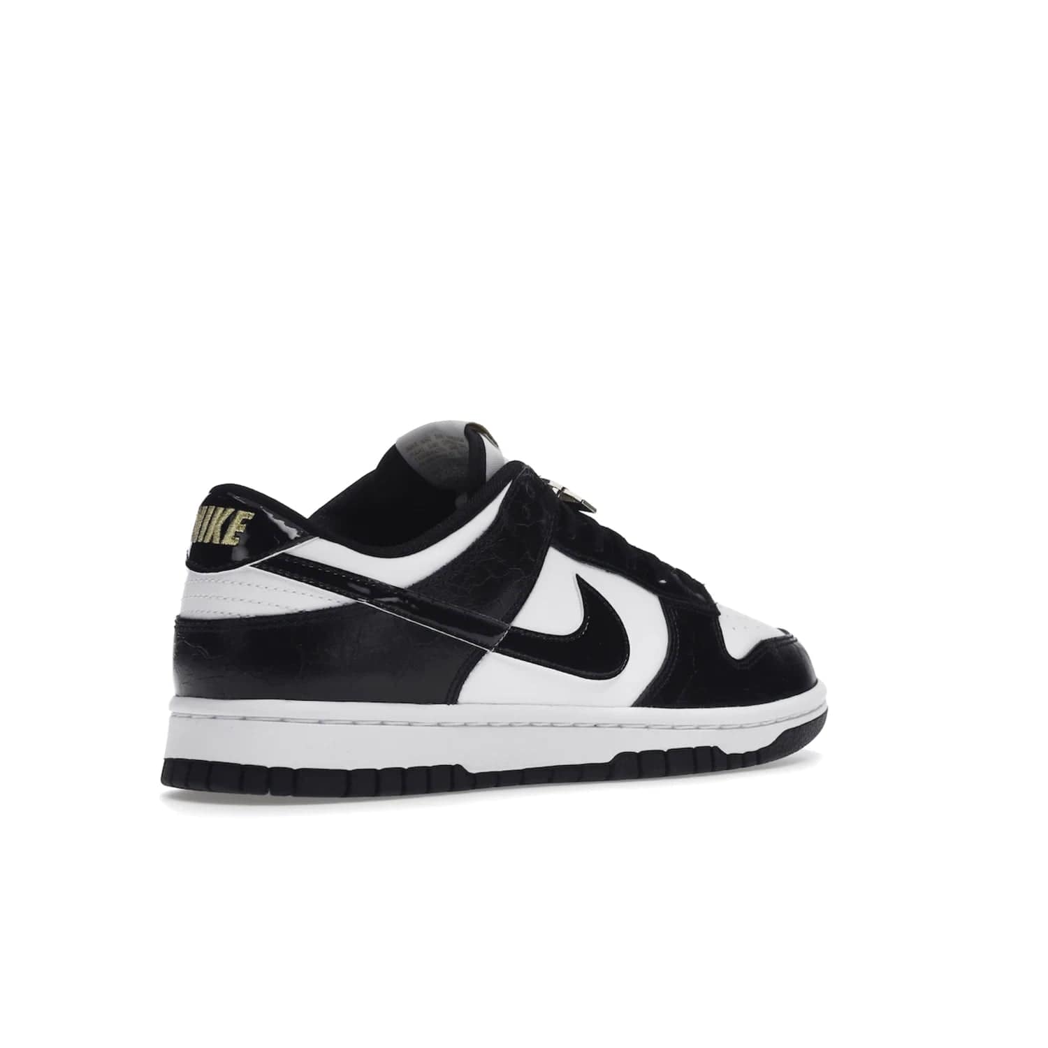 Nike Dunk Low SE World Champs Black White - Image 33 - Only at www.BallersClubKickz.com - Step up your look with the Nike Dunk Low SE World Champs Black White. Leather base, lace eyelets, Swoosh design, gold-stitched brand, and black and gold lace dubraes. Get it in May 2022 for $120.