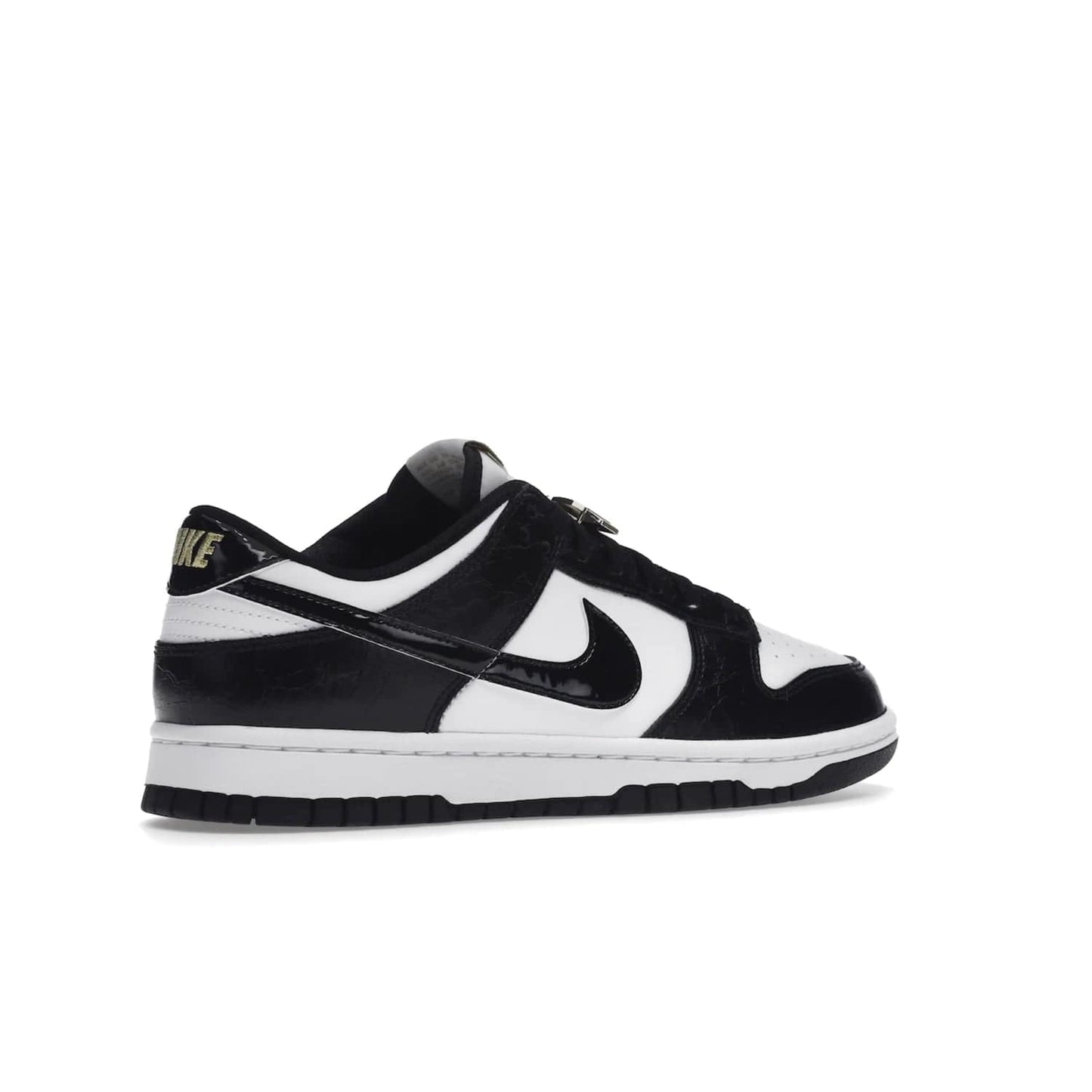 Nike Dunk Low SE World Champs Black White - Image 34 - Only at www.BallersClubKickz.com - Step up your look with the Nike Dunk Low SE World Champs Black White. Leather base, lace eyelets, Swoosh design, gold-stitched brand, and black and gold lace dubraes. Get it in May 2022 for $120.