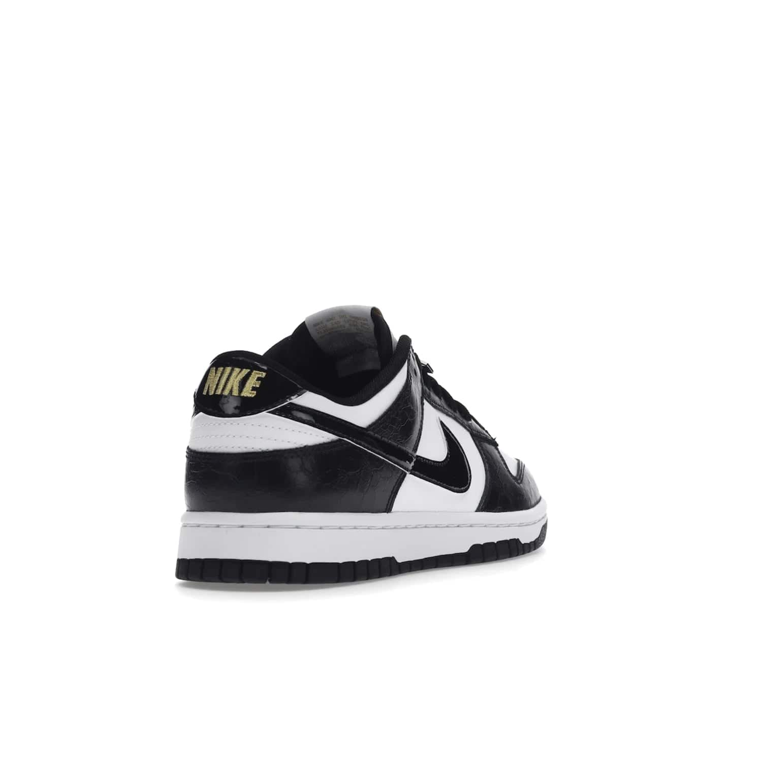 Nike Dunk Low SE World Champs Black White - Image 31 - Only at www.BallersClubKickz.com - Step up your look with the Nike Dunk Low SE World Champs Black White. Leather base, lace eyelets, Swoosh design, gold-stitched brand, and black and gold lace dubraes. Get it in May 2022 for $120.