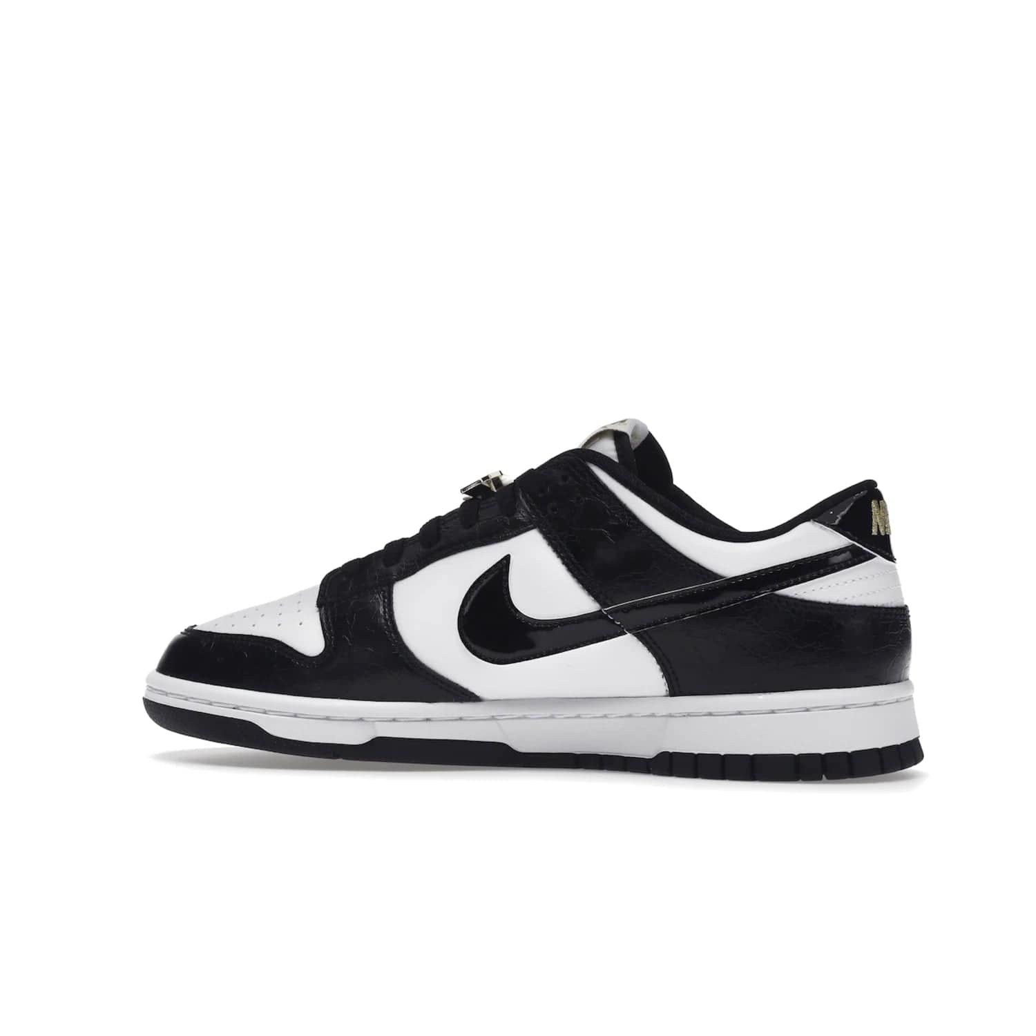 Nike Dunk Low SE World Champs Black White - Image 21 - Only at www.BallersClubKickz.com - Step up your look with the Nike Dunk Low SE World Champs Black White. Leather base, lace eyelets, Swoosh design, gold-stitched brand, and black and gold lace dubraes. Get it in May 2022 for $120.