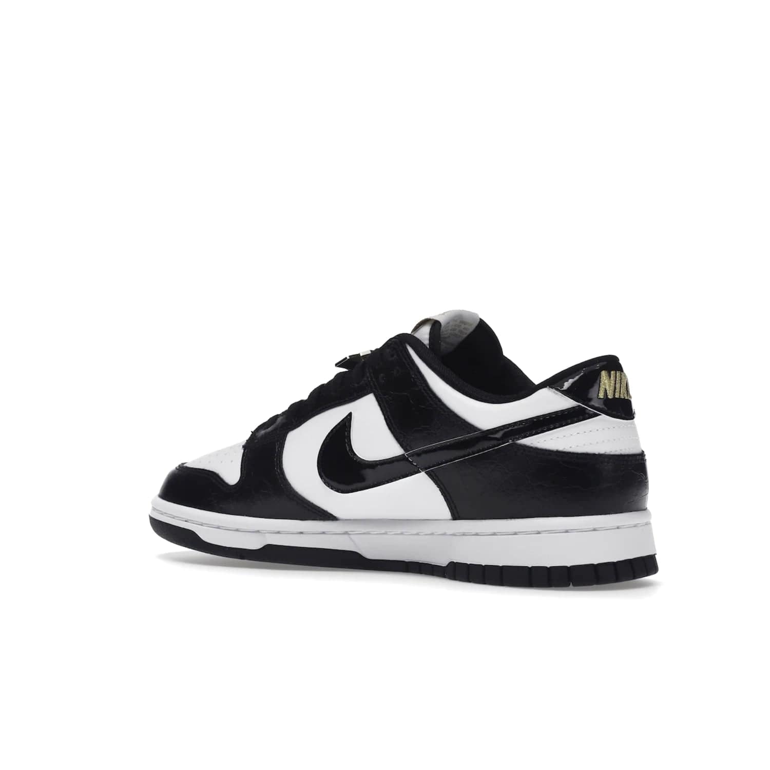 Nike Dunk Low SE World Champs Black White - Image 23 - Only at www.BallersClubKickz.com - Step up your look with the Nike Dunk Low SE World Champs Black White. Leather base, lace eyelets, Swoosh design, gold-stitched brand, and black and gold lace dubraes. Get it in May 2022 for $120.