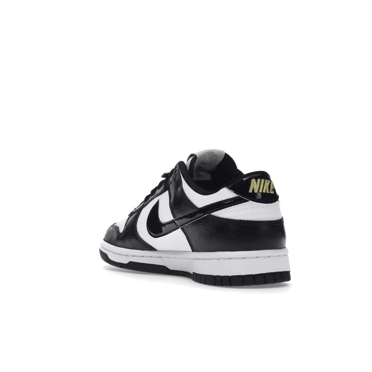 Nike Dunk Low SE World Champs Black White - Image 25 - Only at www.BallersClubKickz.com - Step up your look with the Nike Dunk Low SE World Champs Black White. Leather base, lace eyelets, Swoosh design, gold-stitched brand, and black and gold lace dubraes. Get it in May 2022 for $120.