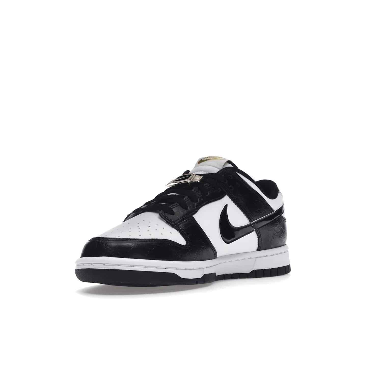 Nike Dunk Low SE World Champs Black White - Image 14 - Only at www.BallersClubKickz.com - Step up your look with the Nike Dunk Low SE World Champs Black White. Leather base, lace eyelets, Swoosh design, gold-stitched brand, and black and gold lace dubraes. Get it in May 2022 for $120.