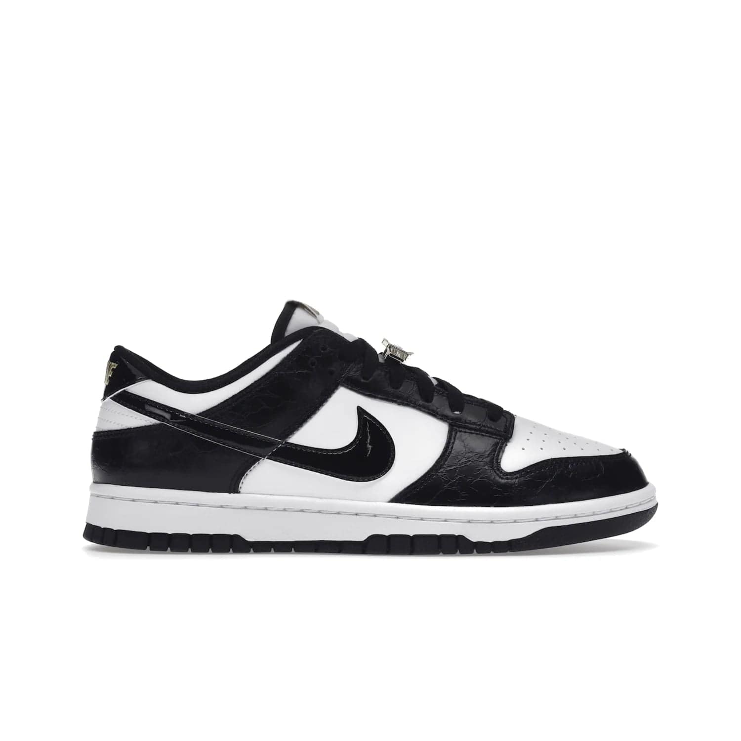 Nike Dunk Low SE World Champs Black White - Image 1 - Only at www.BallersClubKickz.com - Step up your look with the Nike Dunk Low SE World Champs Black White. Leather base, lace eyelets, Swoosh design, gold-stitched brand, and black and gold lace dubraes. Get it in May 2022 for $120.