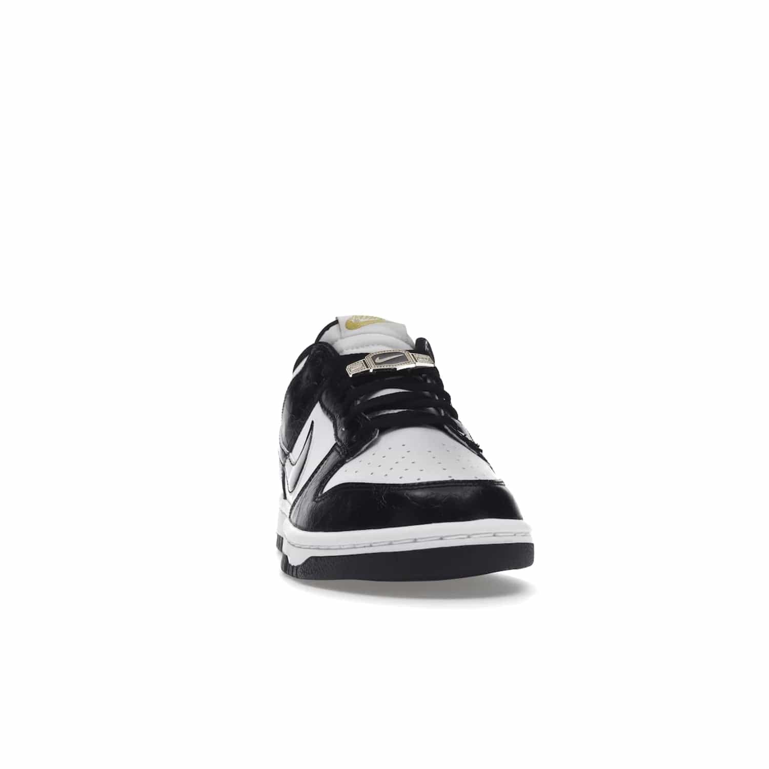 Nike Dunk Low SE World Champs Black White - Image 9 - Only at www.BallersClubKickz.com - Step up your look with the Nike Dunk Low SE World Champs Black White. Leather base, lace eyelets, Swoosh design, gold-stitched brand, and black and gold lace dubraes. Get it in May 2022 for $120.