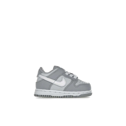 Nike Dunk Low Two-Toned Grey (TD) - Image 1 - Only at www.BallersClubKickz.com - Clean and sharp Nike Dunk Low Two-Toned Grey (TD) release on March 1, 2022. Pure Platinum and White-Wolf Grey design with extra-cushioned midsole for optimal comfort and style.