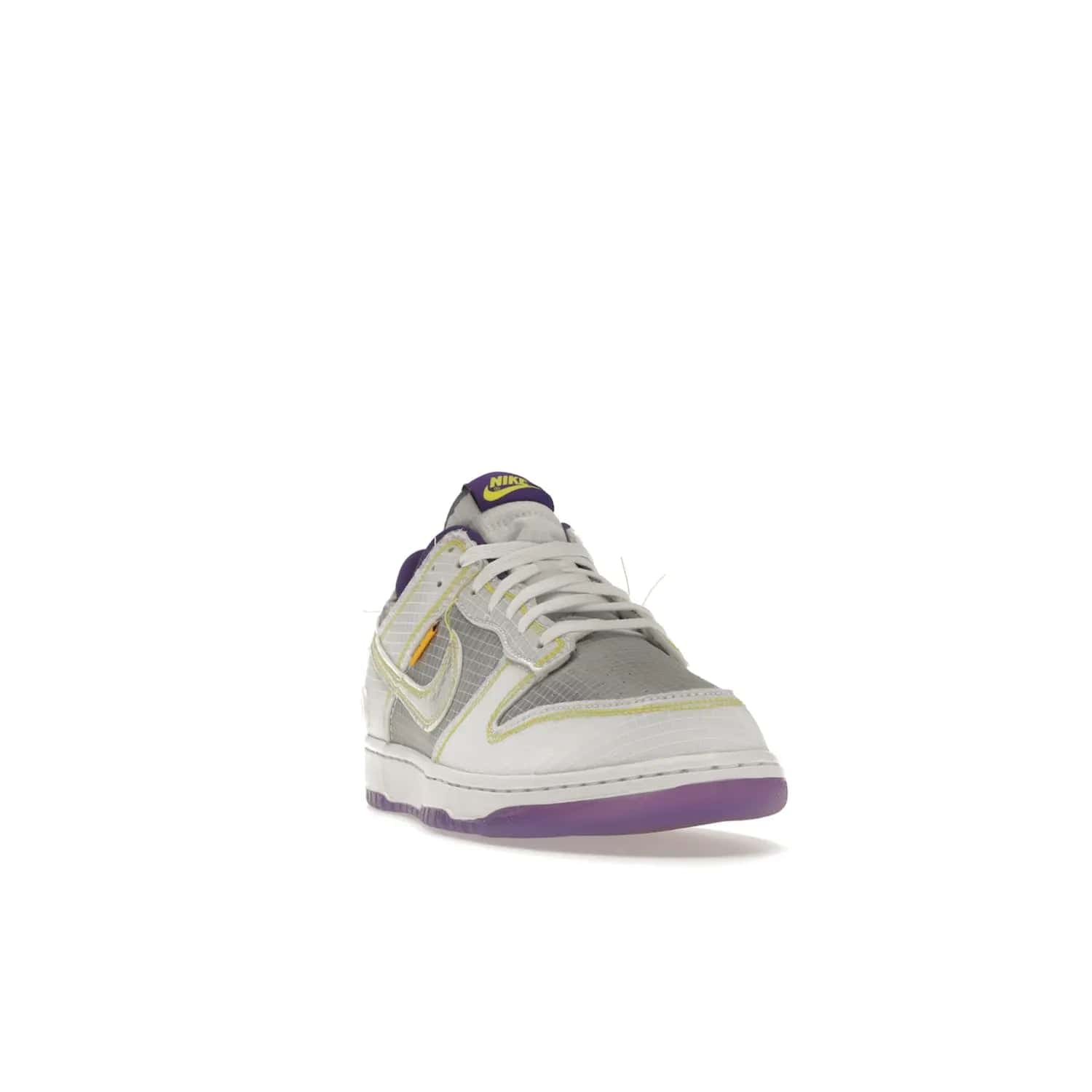 Nike Dunk Low Union Passport Pack Court Purple - Image 8 - Only at www.BallersClubKickz.com - Nike Dunk Low Union LA Passport Pack Court Purple features Court Purple and white smooth leather construction and Union LA Frontman logo on the heel. Releasing in April of 2022, this iconic shoe will make a splash in the streetwear world.