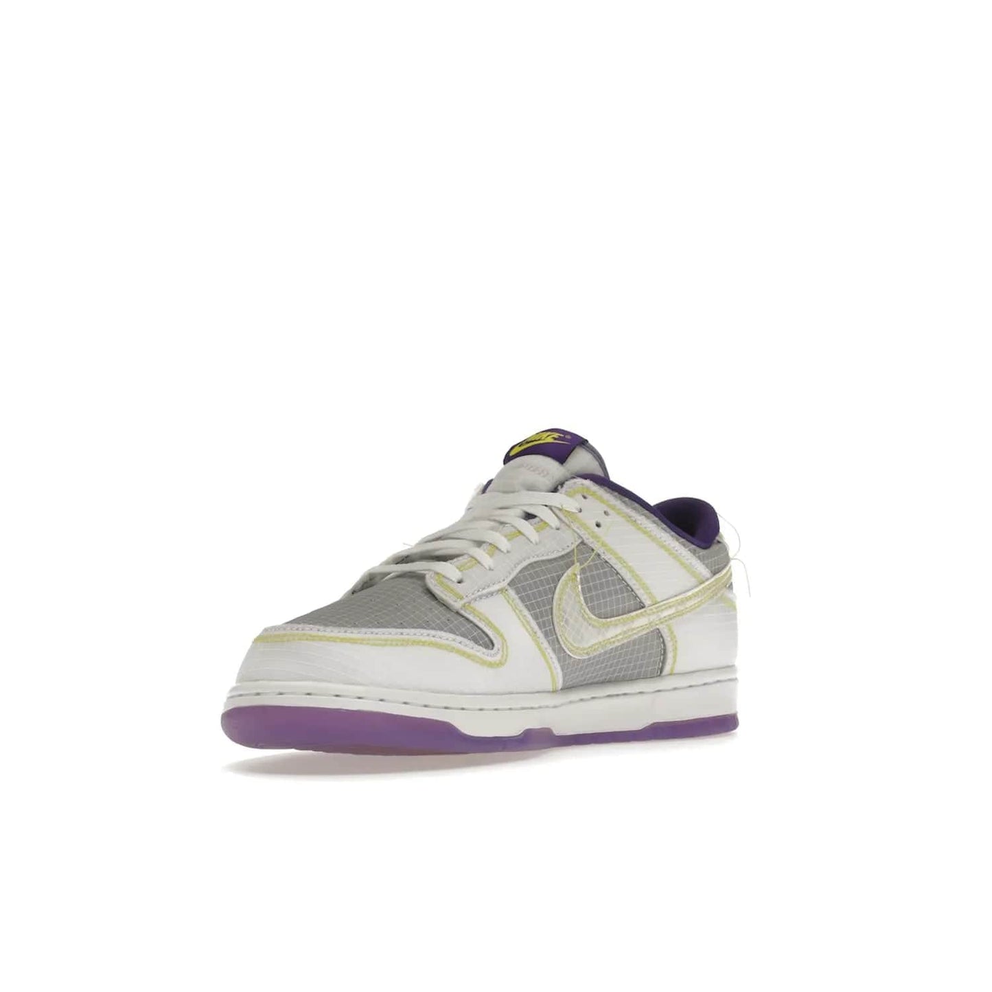 Nike Dunk Low Union Passport Pack Court Purple - Image 14 - Only at www.BallersClubKickz.com - Nike Dunk Low Union LA Passport Pack Court Purple features Court Purple and white smooth leather construction and Union LA Frontman logo on the heel. Releasing in April of 2022, this iconic shoe will make a splash in the streetwear world.