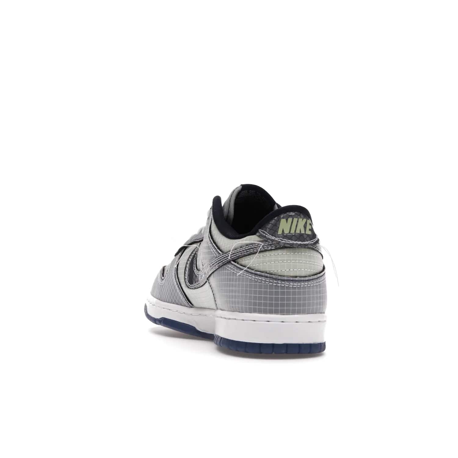 Nike Dunk Low Union Passport Pack Pistachio - Image 26 - Only at www.BallersClubKickz.com - Shop the Nike Dunk Low Union Passport Pack Pistachio! This statement-making silhouette combines light green and navy leather with a semi-translucent ripstop nylon. Comes with exclusive Walter Lee Young-inspired emblem at the heel and a yellow Union LA tab on the quarter panel. Releasing February 2022.