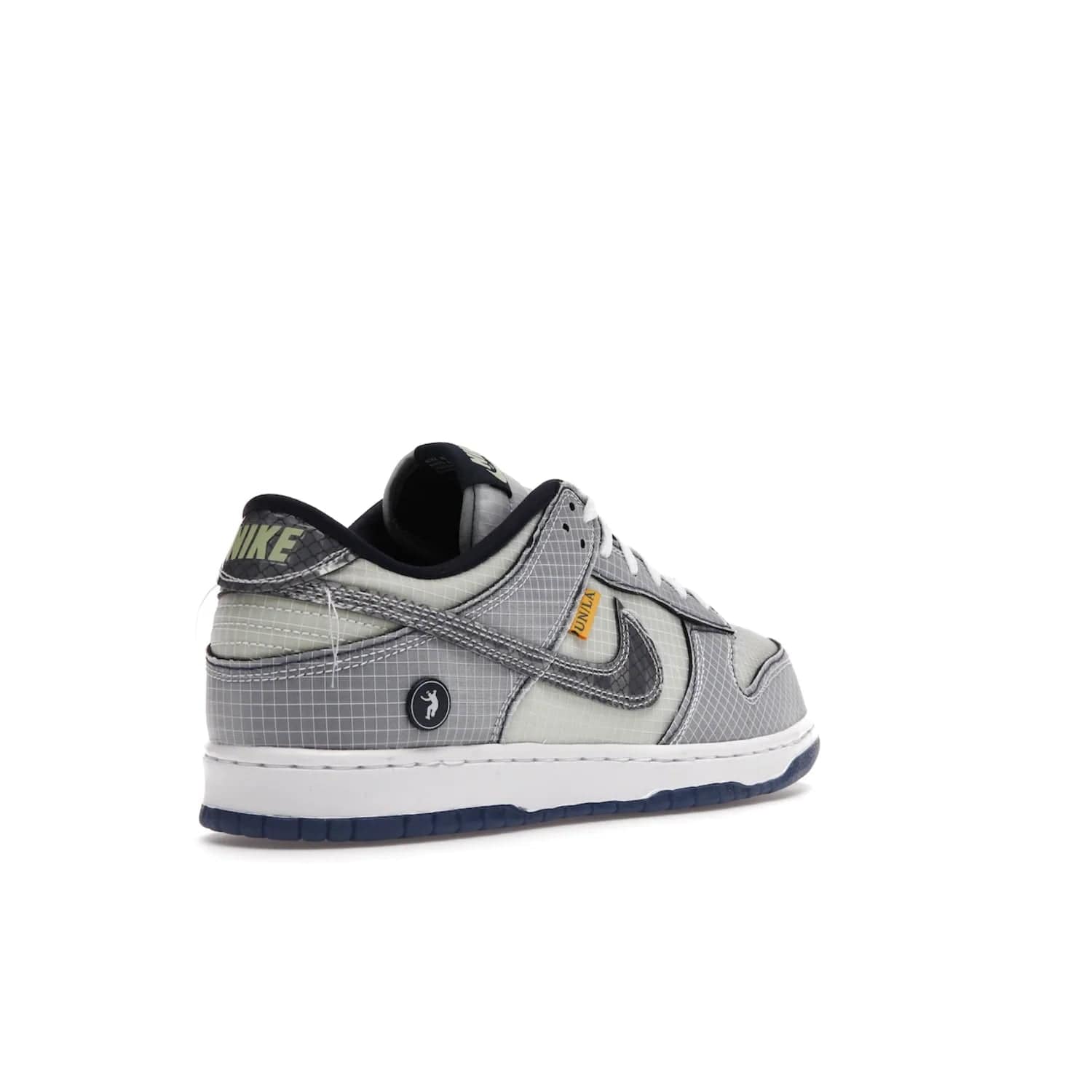 Nike Dunk Low Union Passport Pack Pistachio - Image 32 - Only at www.BallersClubKickz.com - Shop the Nike Dunk Low Union Passport Pack Pistachio! This statement-making silhouette combines light green and navy leather with a semi-translucent ripstop nylon. Comes with exclusive Walter Lee Young-inspired emblem at the heel and a yellow Union LA tab on the quarter panel. Releasing February 2022.