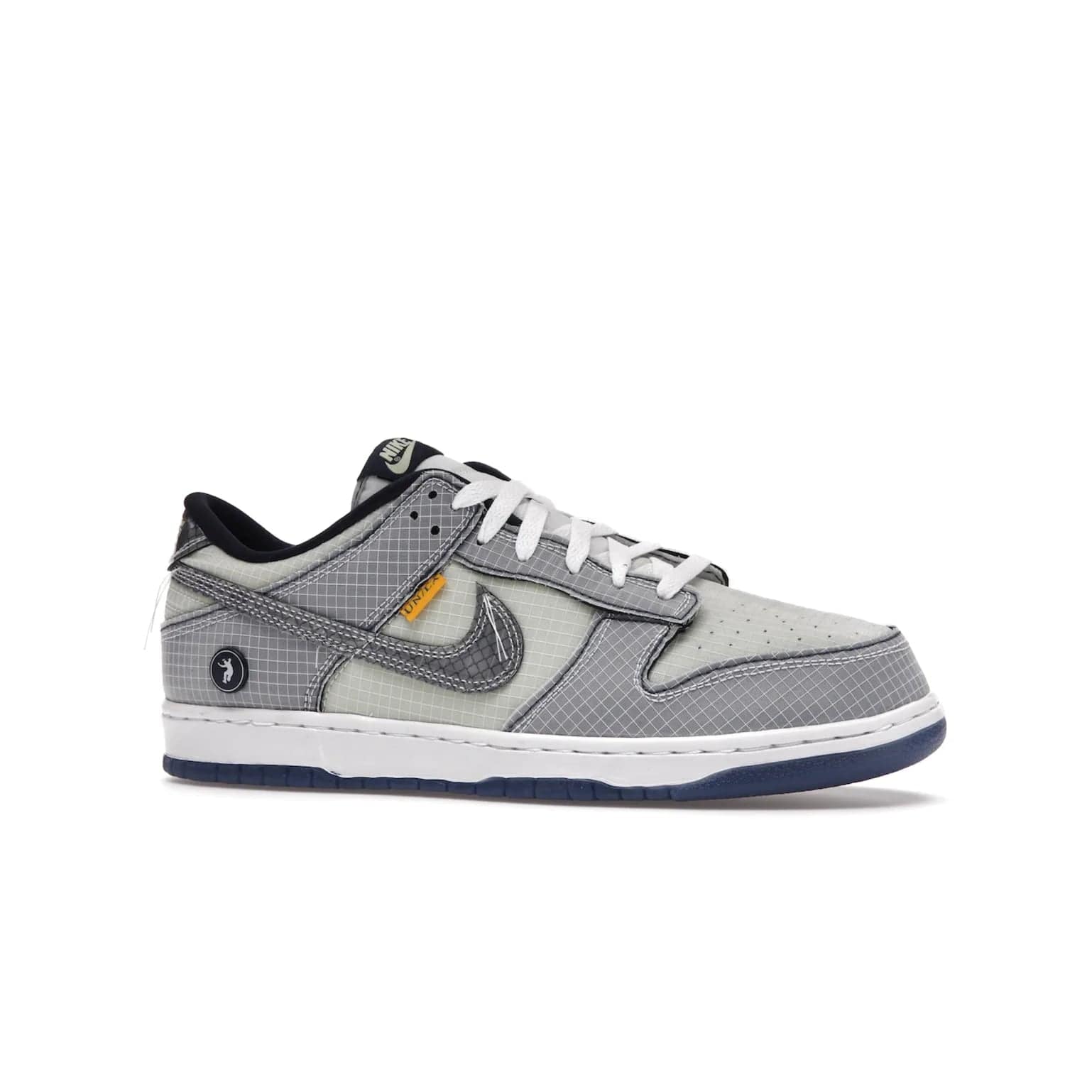 Nike Dunk Low Union Passport Pack Pistachio - Image 3 - Only at www.BallersClubKickz.com - Shop the Nike Dunk Low Union Passport Pack Pistachio! This statement-making silhouette combines light green and navy leather with a semi-translucent ripstop nylon. Comes with exclusive Walter Lee Young-inspired emblem at the heel and a yellow Union LA tab on the quarter panel. Releasing February 2022.