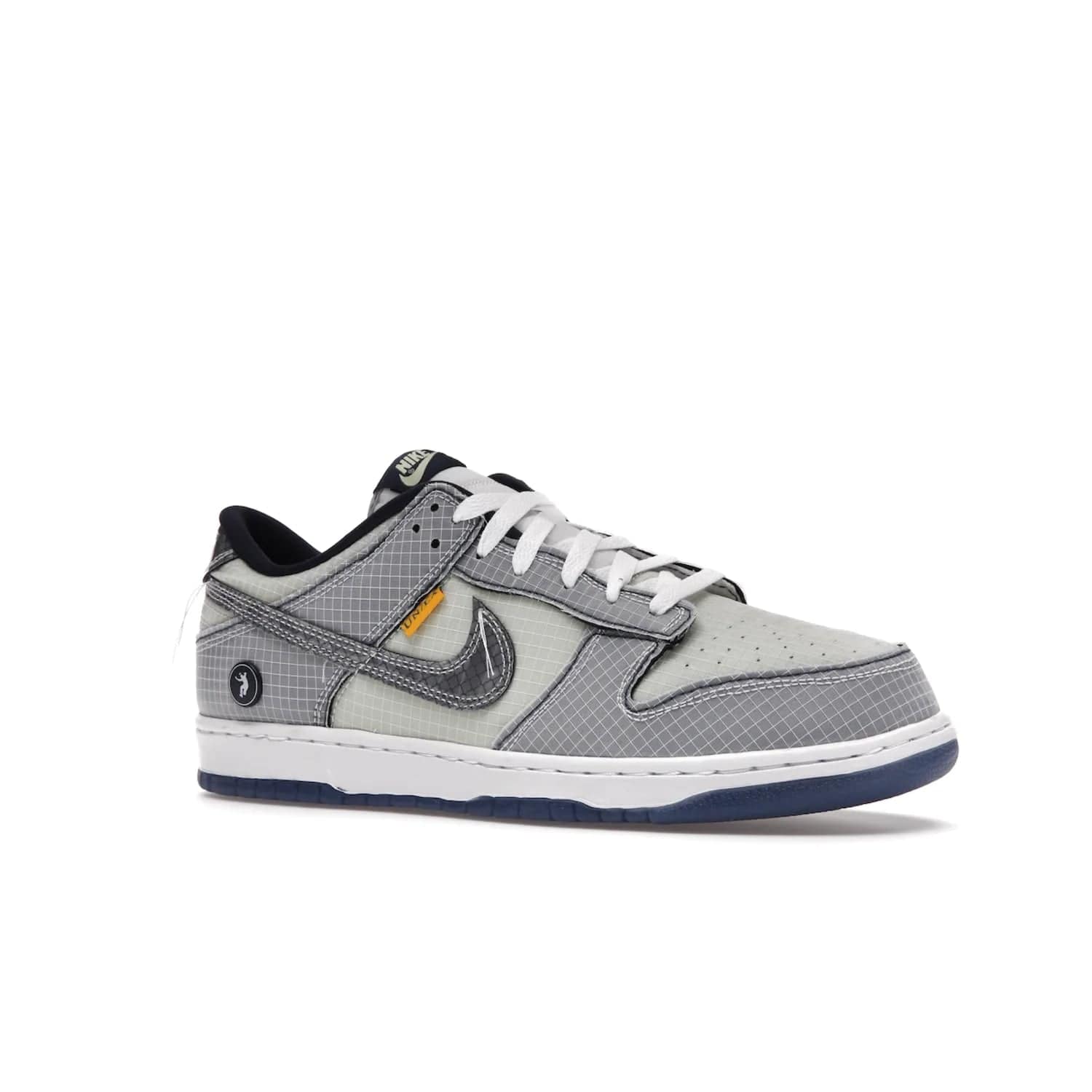 Nike Dunk Low Union Passport Pack Pistachio - Image 4 - Only at www.BallersClubKickz.com - Shop the Nike Dunk Low Union Passport Pack Pistachio! This statement-making silhouette combines light green and navy leather with a semi-translucent ripstop nylon. Comes with exclusive Walter Lee Young-inspired emblem at the heel and a yellow Union LA tab on the quarter panel. Releasing February 2022.