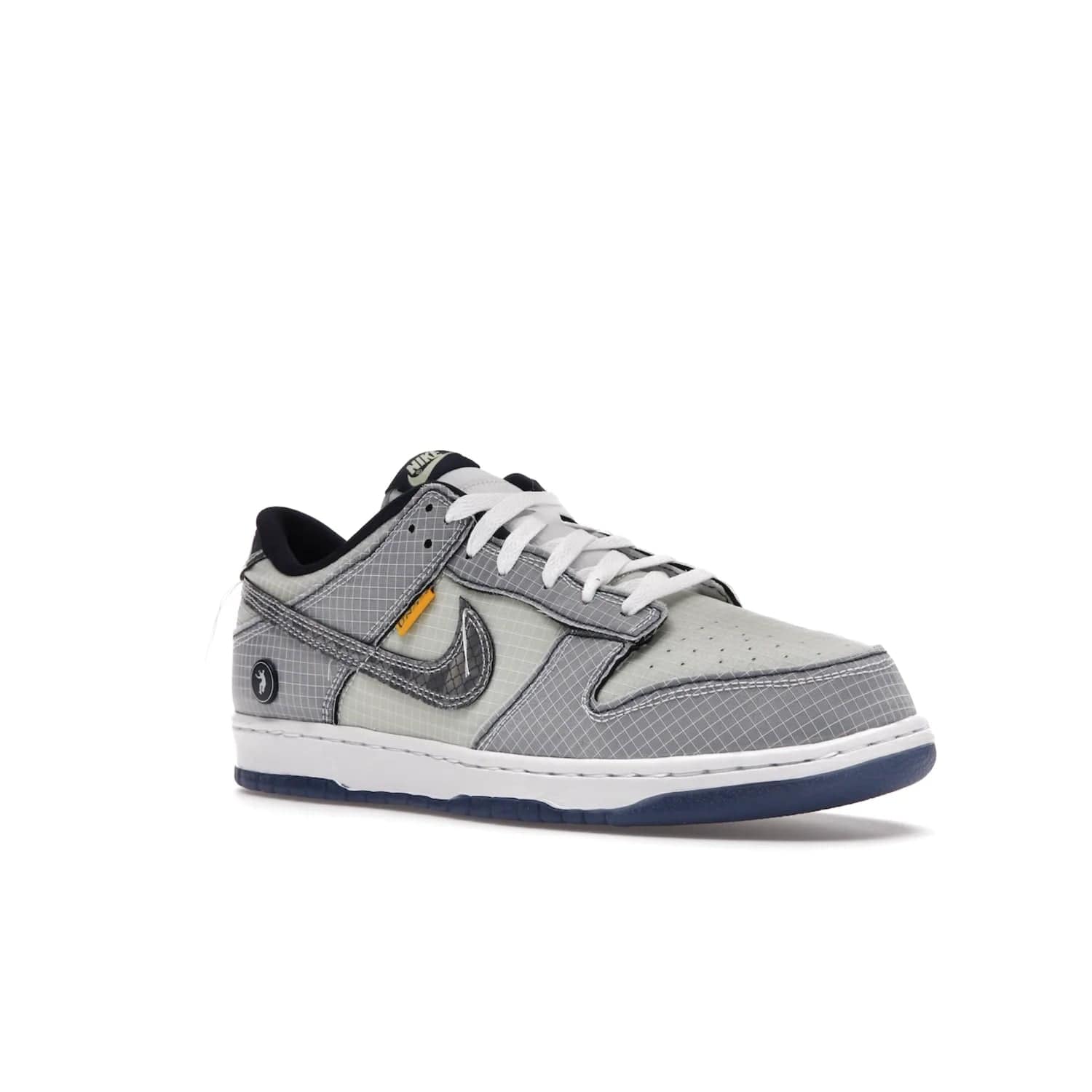 Nike Dunk Low Union Passport Pack Pistachio - Image 5 - Only at www.BallersClubKickz.com - Shop the Nike Dunk Low Union Passport Pack Pistachio! This statement-making silhouette combines light green and navy leather with a semi-translucent ripstop nylon. Comes with exclusive Walter Lee Young-inspired emblem at the heel and a yellow Union LA tab on the quarter panel. Releasing February 2022.