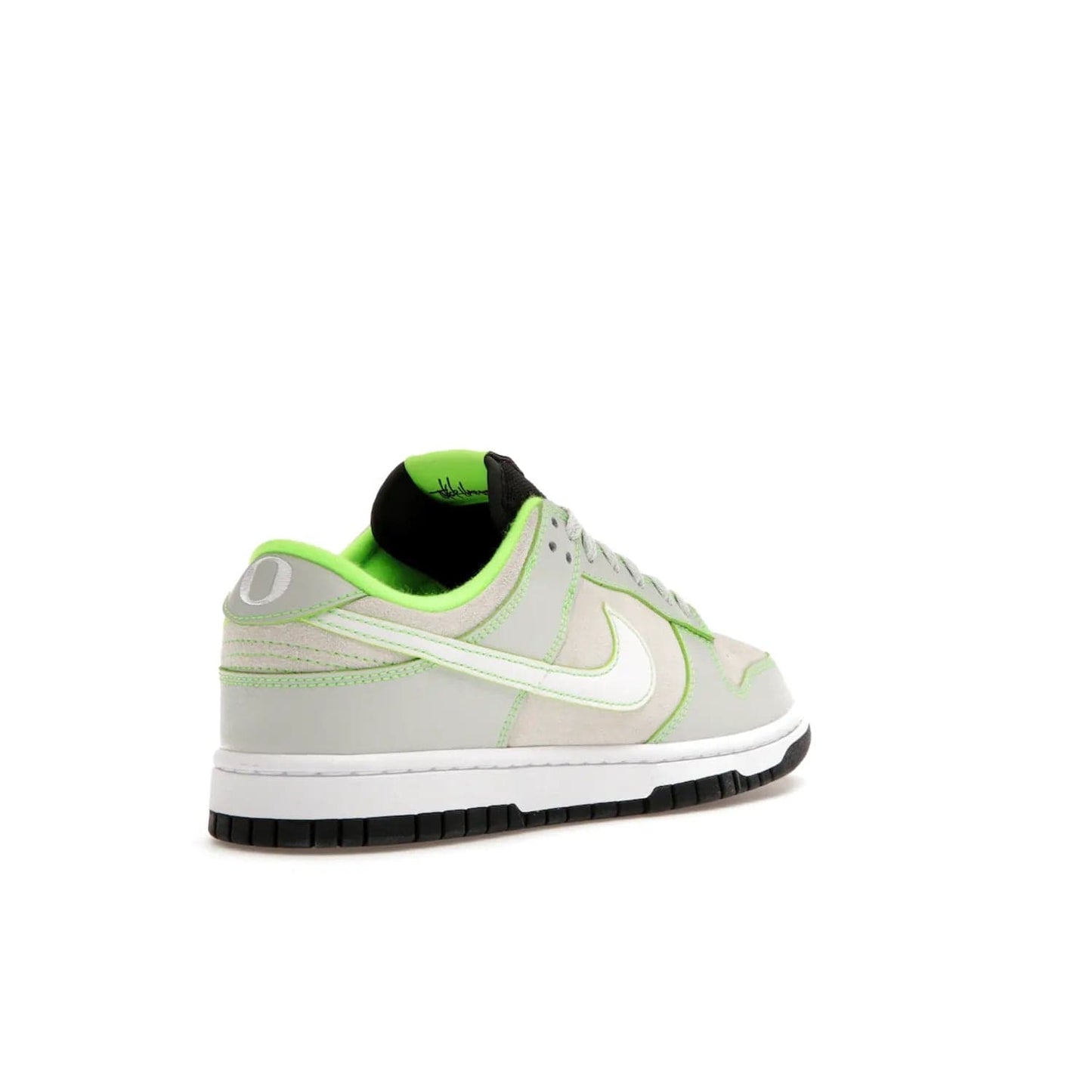 Nike Dunk Low University of Oregon PE (2023) - Image 32 - Only at www.BallersClubKickz.com - Sleek Light Silver and White upper, complemented by Black and Electric Green accents. Nike Dunk Low University of Oregon PE, set to be released April 2023. Must-have for any serious fan.