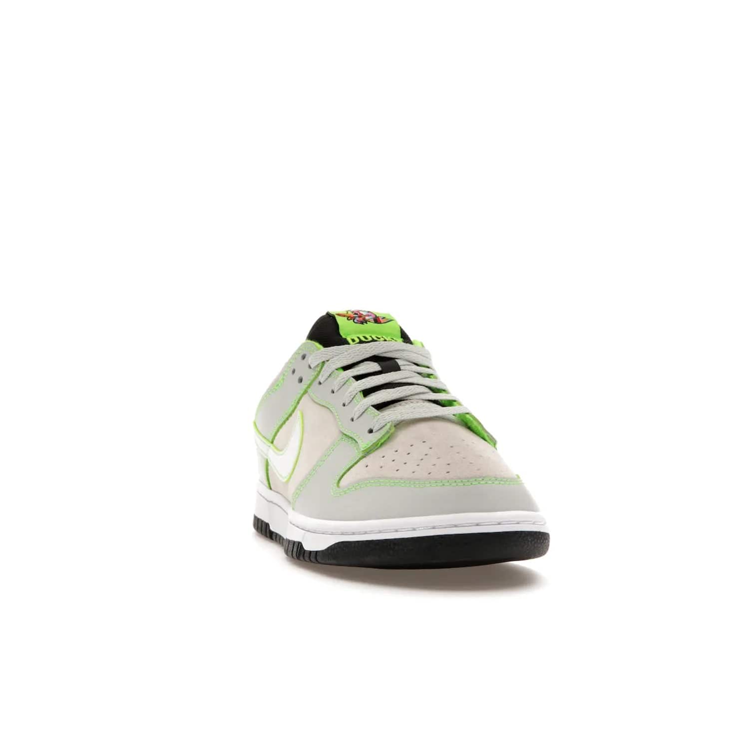 Nike Dunk Low University of Oregon PE (2023) - Image 8 - Only at www.BallersClubKickz.com - Sleek Light Silver and White upper, complemented by Black and Electric Green accents. Nike Dunk Low University of Oregon PE, set to be released April 2023. Must-have for any serious fan.