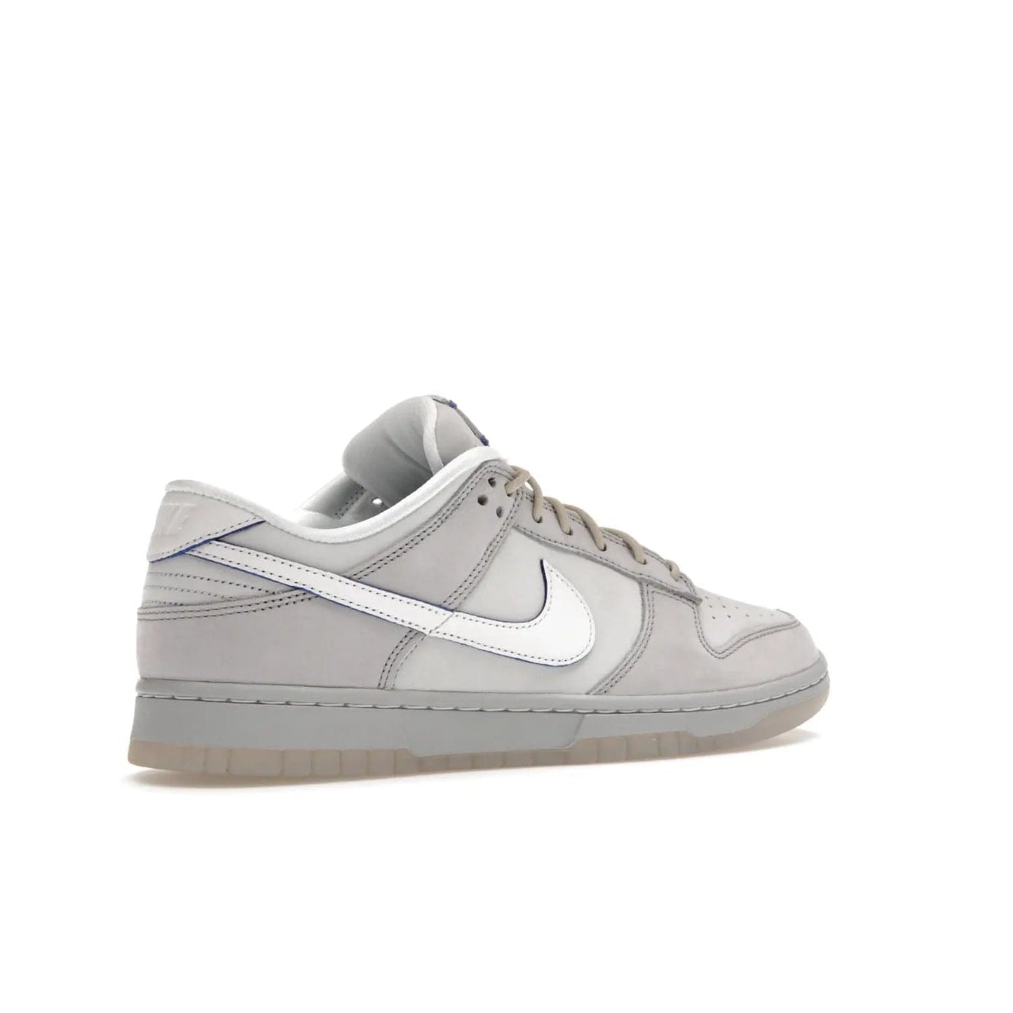 Nike Dunk Low Wolf Grey Pure Platinum - Image 34 - Only at www.BallersClubKickz.com - A timeless classic. The Nike Dunk Low Wolf Grey Pure Platinum combines wolf grey and pure platinum for a unique and eye-catching look. Available on August 15, 2022.